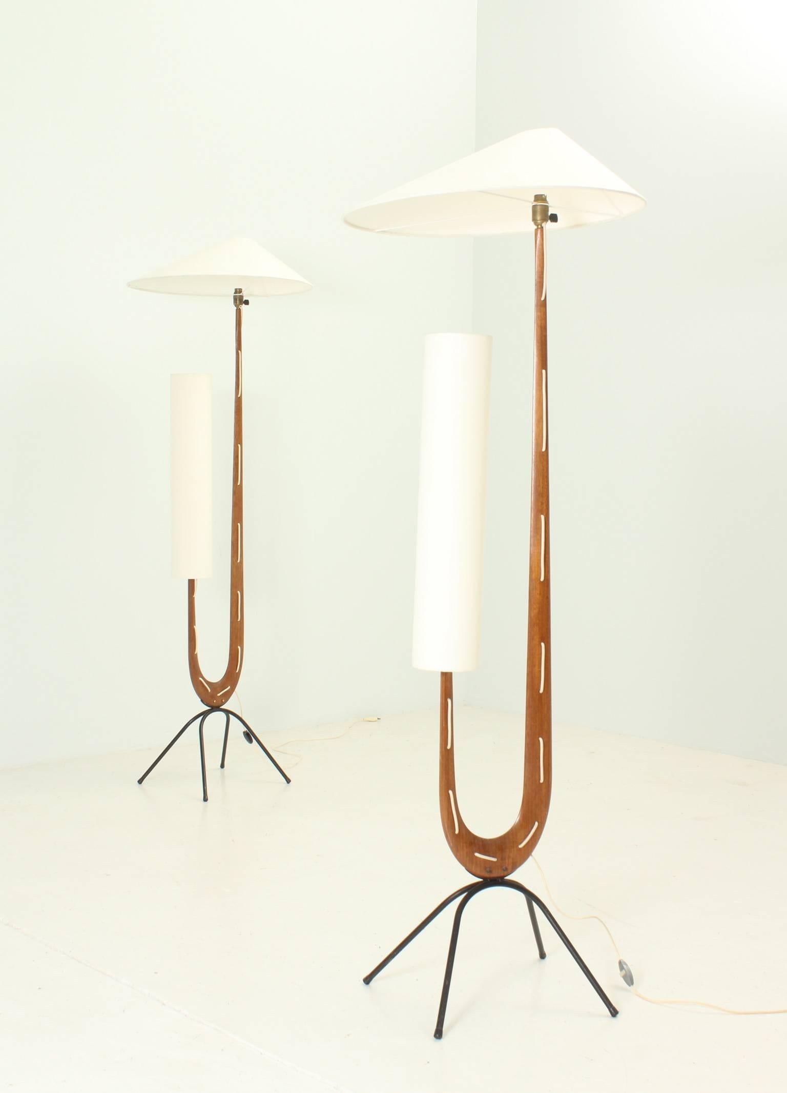 Pair of Giraffe floor lamps designed in 1950s by Jean Rispal, France. Teakwood with black iron bases, original shades with new fabric.