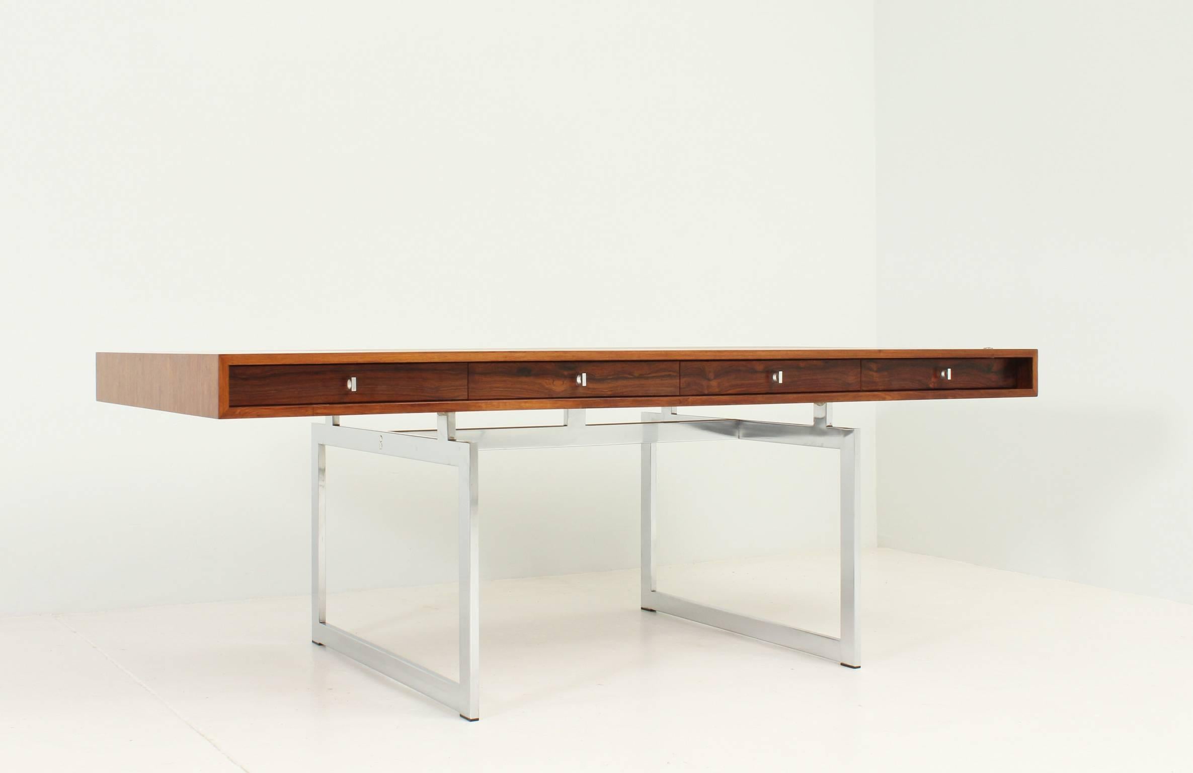 Large desk designed by Bodil Kjaer in 1959 for E. Pedersen and Søns, Denmark. Rio rosewood top and steel base with four drawers.