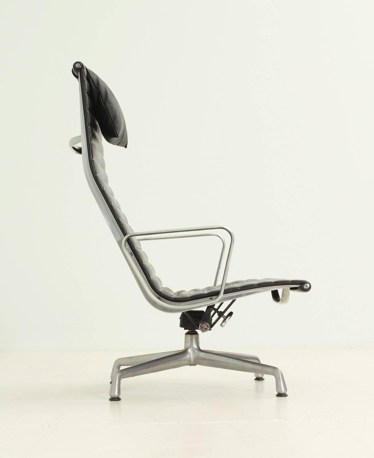 Aluminium Group lounge chair model EA124 designed by Charles and Ray Eames for Herman Miller, USA, 1958. Polished aluminium frame upholstered in black leather, swivel and adjustable.