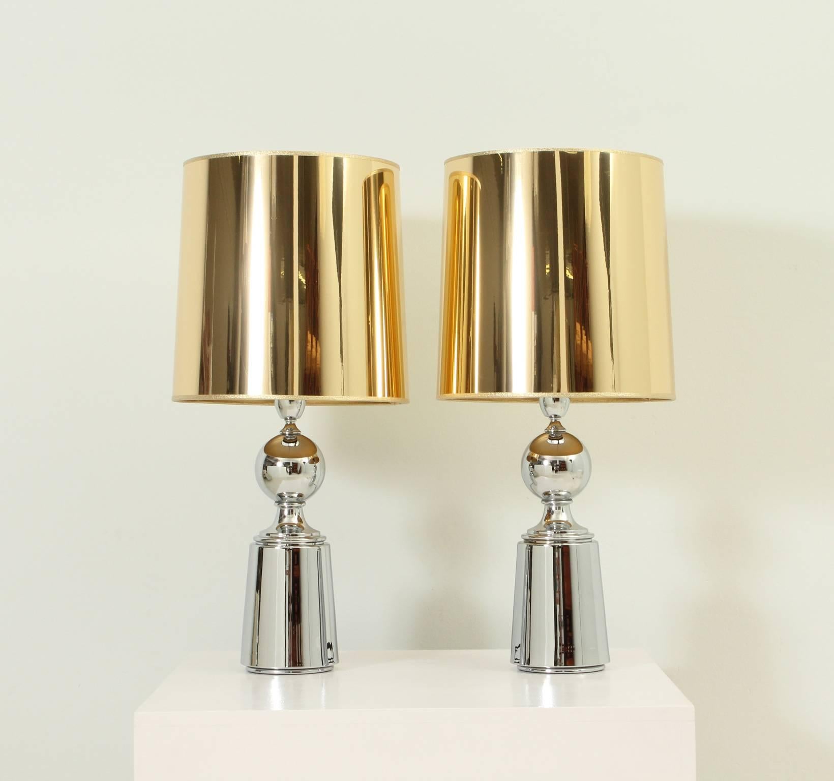 Pair of table lamps designed in 1970s by Metalarte, Spain. Chromed metal base with new gold plastic shade.