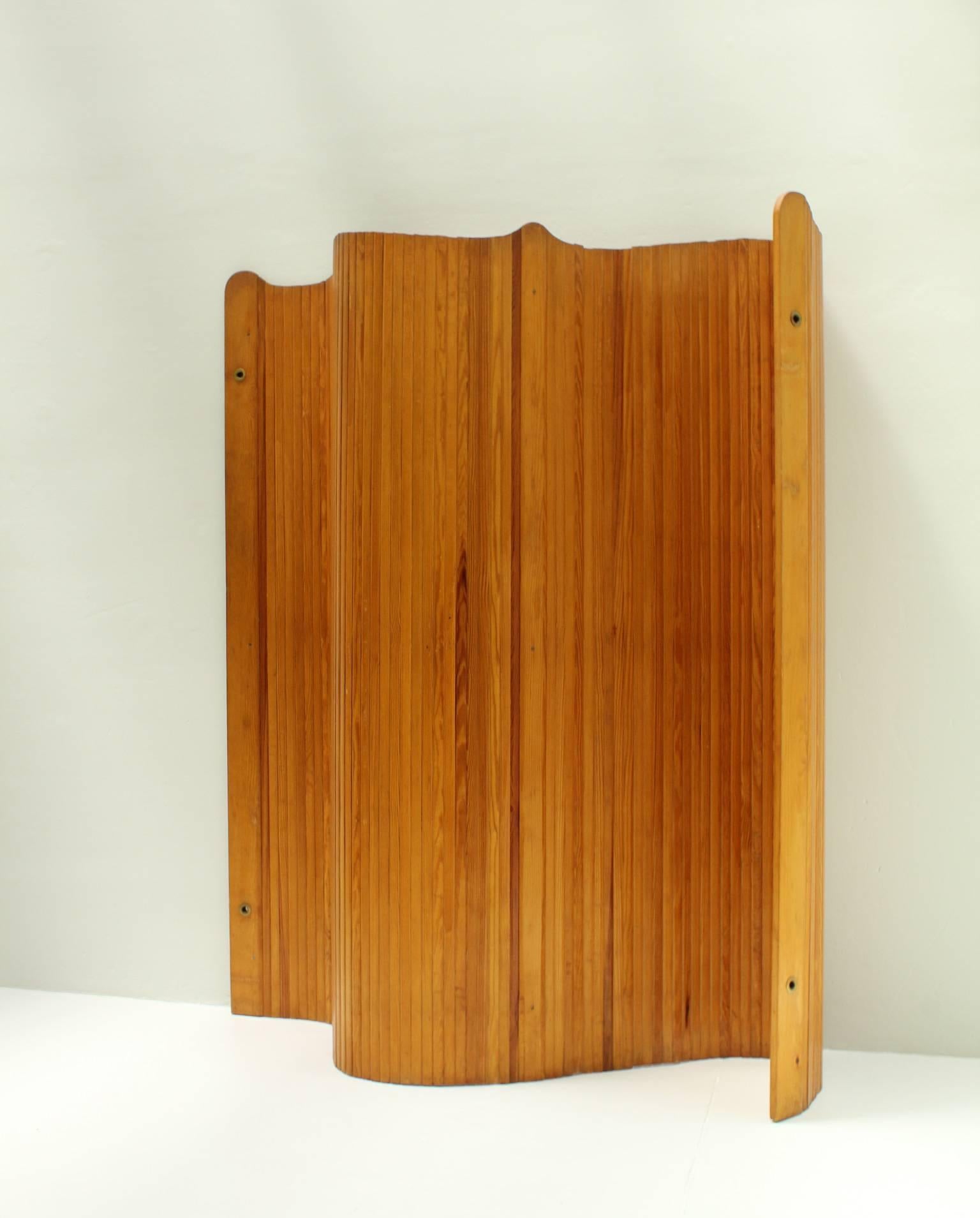 Folding screen designed in 1930s by Jomaine Baumann, Paris. Oregon pinewood and brass. It could take different positions.