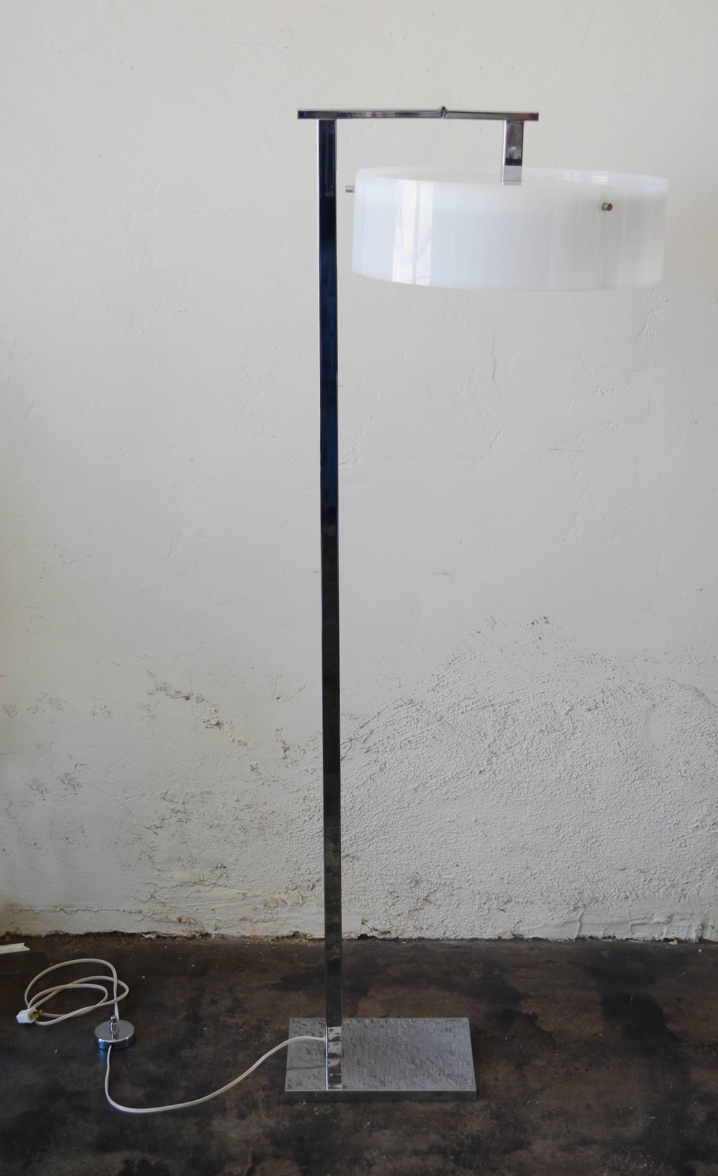 Flip-top floor lamp in the style of Kurt Versen. The shade can be placed in an upward or downward position. The lamp takes three bulbs. This does not have a diffuser on the bulb side. The lamp uses a foot switch. It has been rewired. Dimensions
