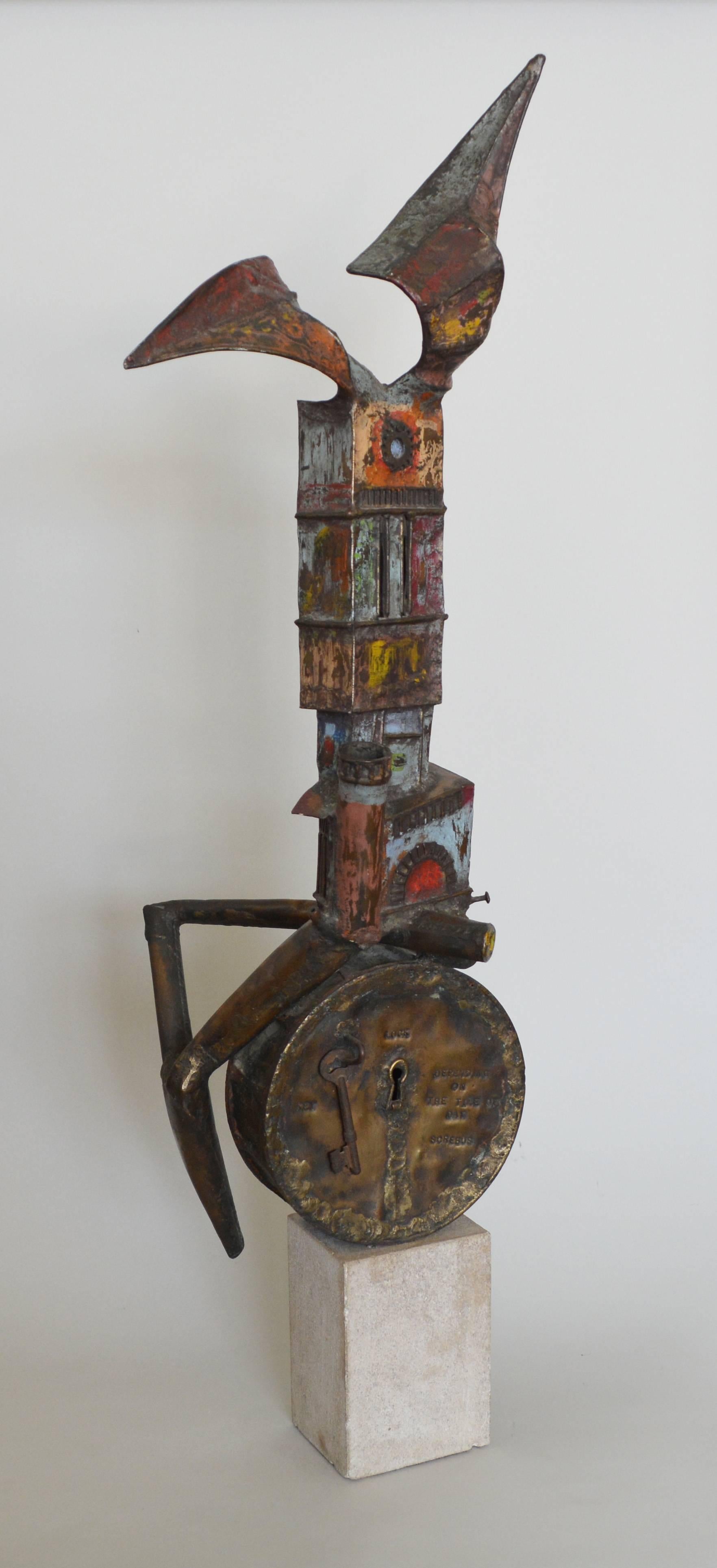 Surrealist sculpture with painted bronze and found objects by Clyde Ball. This is signed on the front. There is a small chip to the base.