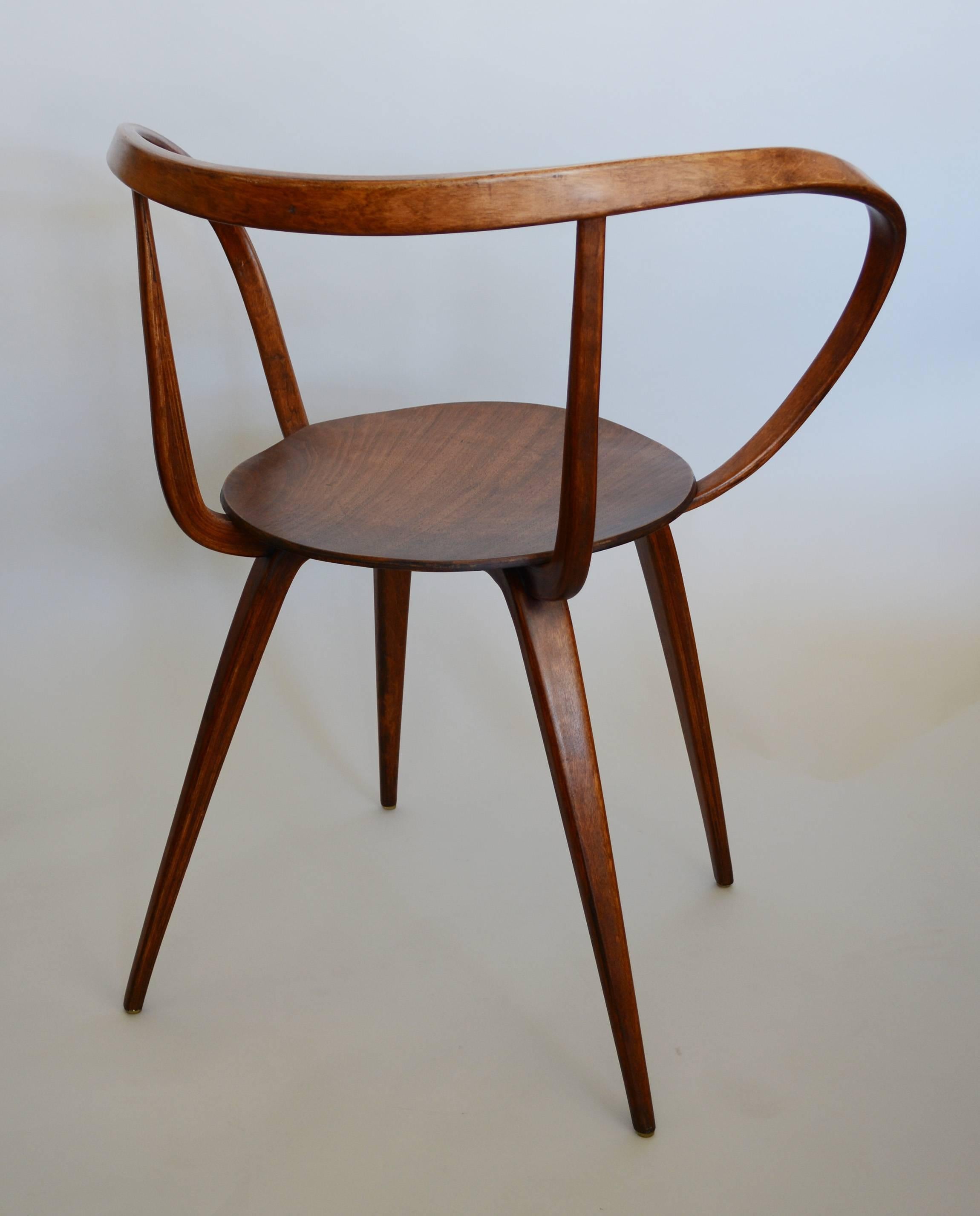 Laminated chair designed by John Pile in 1952. The chair never went into production until Plycraft took on production in 1957. Due to differences with Herman Miller it was only made for one year. This chair looks to have been refinished some time