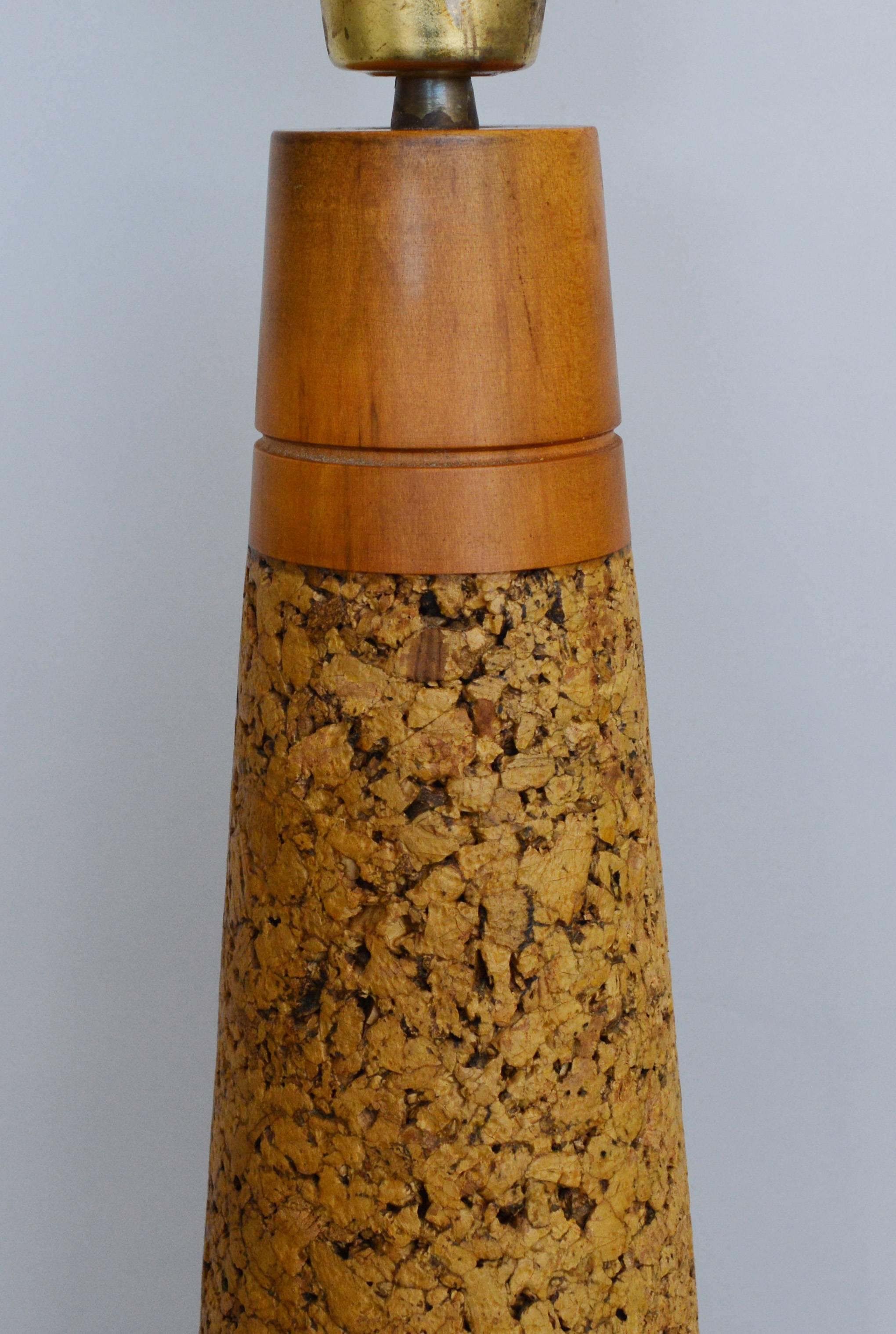 Tall lacquered cork and birch table lamp. This lamp has it's original finish. There is a little darkening on areas of the birch.