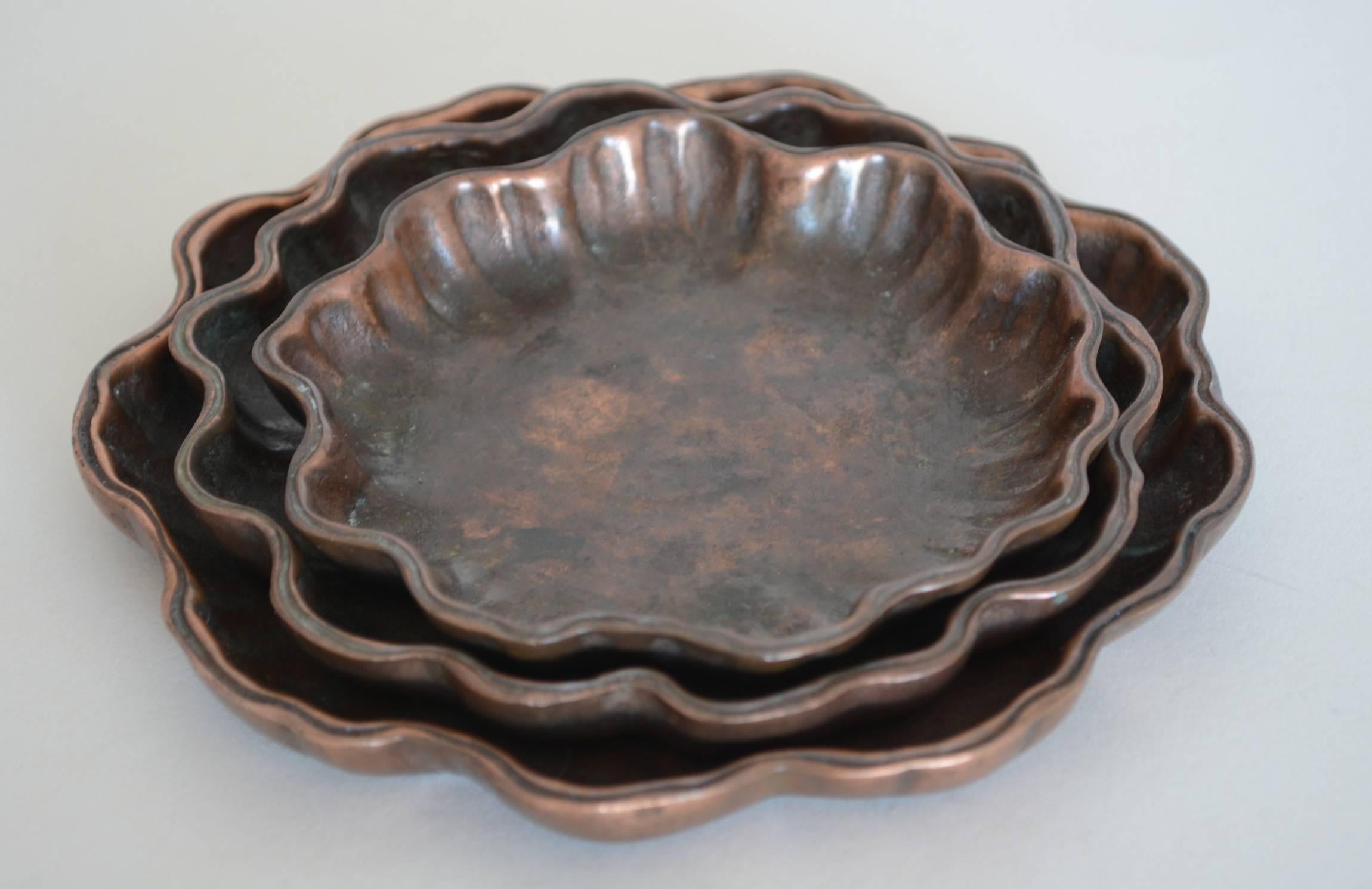 Three bronze nesting trays in the form of lily pads by Tiffany Studios. These are all marked Tiffany Studios New York 1719. Dimensions given are for the largest.
