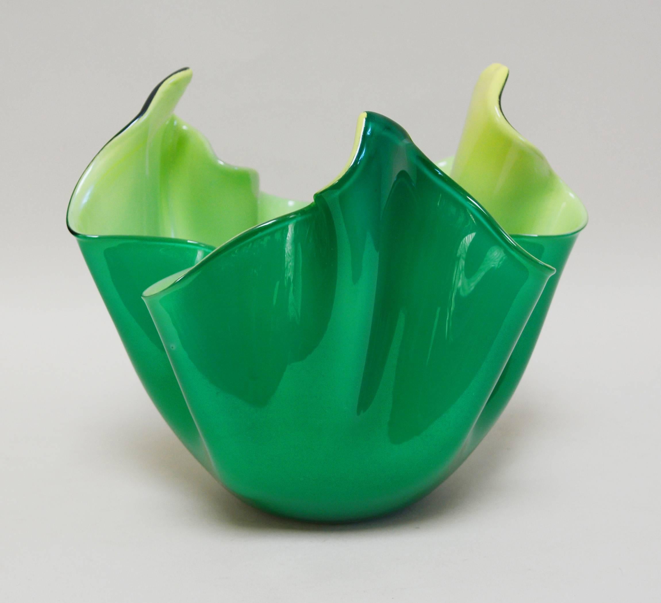 Venini fazzoletto vase with a green exterior and a slightly iridescent pale yellow interior. This form was created by Paolo Venini along with Fulvio Bianconi. This example has the Venini three-line acid stamp.