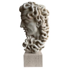 Head of the mythological Medusa carved from white Carrara marble—made in Italy