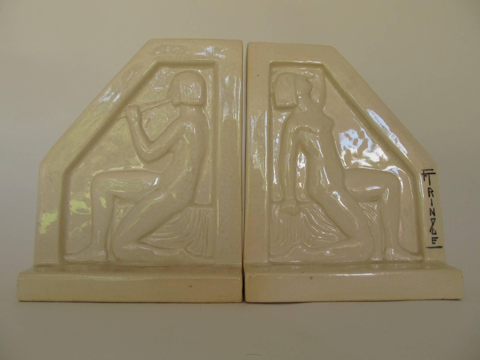 French Art Deco of the 1920s. Architectural forms with bas relief figures on both sides. Each individually signed 