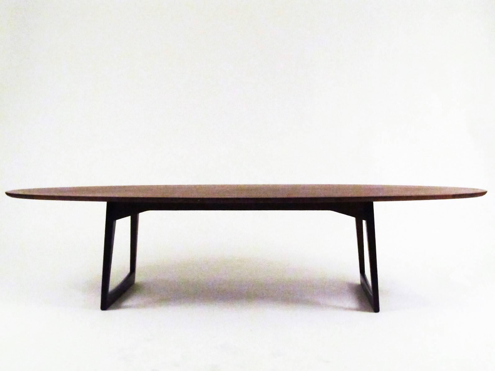 A very nice Mid-Century cocktail or coffee table. There is a very faint maker's mark stamped on the bottom, but I am unable to make it out, or identify the mark. Only the word 