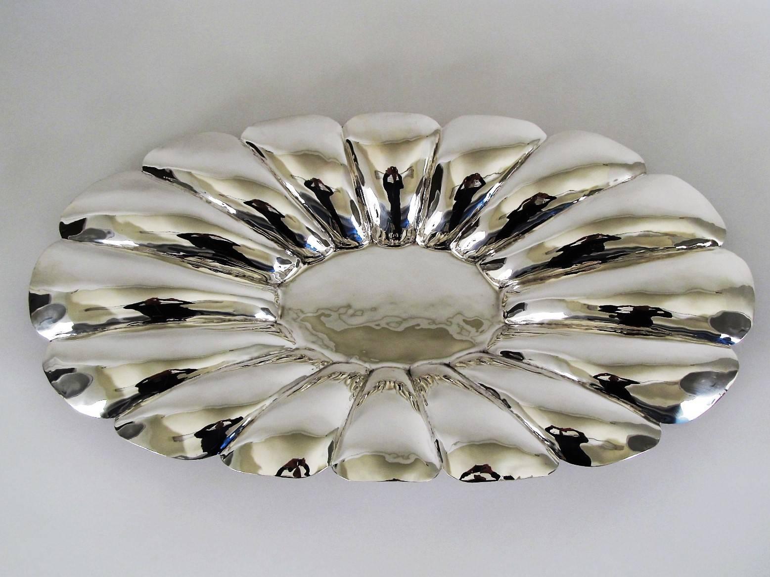 This is a very impressive sterling silver bowl that measures 25 inches across and weighs 1020 grams. Made by Mexican silversmith L. Maciel, circa 1930s-1940s. The entire piece is hand-hammered into a beautifully lobed bowl.