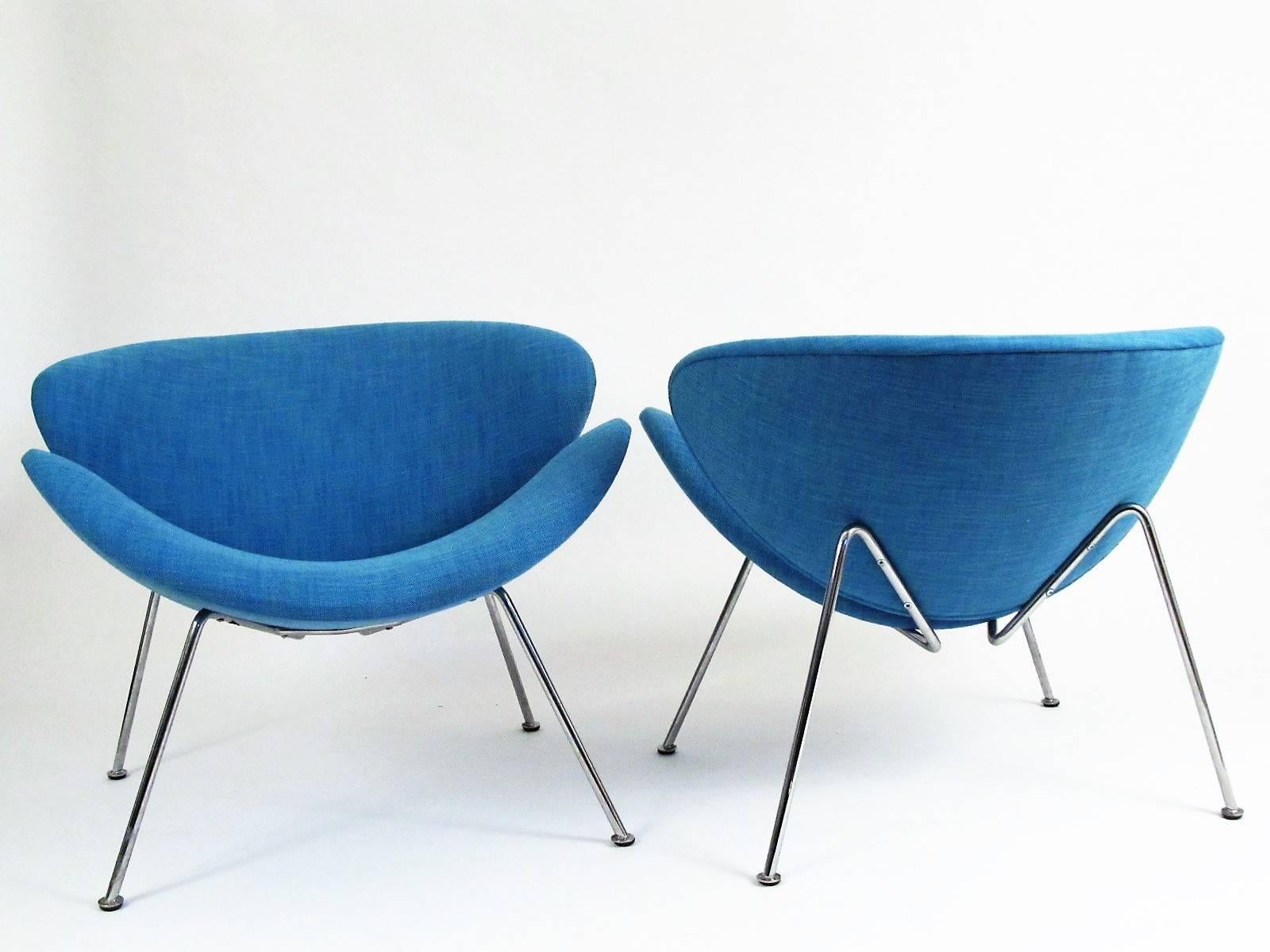 This is a vintage pair of Pierre Paulin Orange Slice chairs made by Artifort in France, newly re-upholstered in Ice Blue. Designed in 1960, this chair is an icon of Mid-Century design. Paulin studied sculpture and his furniture designs seem to