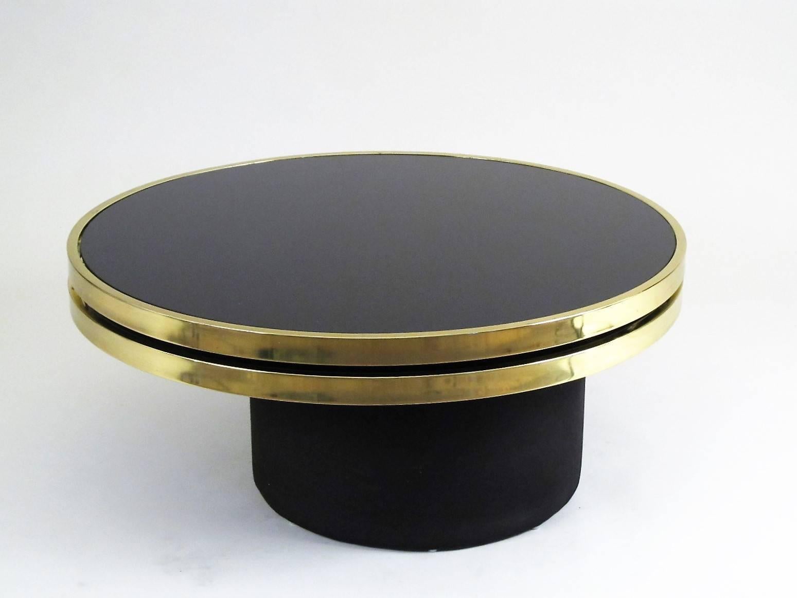 Made by Design Institute of America, or DIA. Although several designers including Milo Baughman have worked with DIA, I don't know the designer of this piece. It is both visually interesting, with its overlapping circles, but also impressive in its