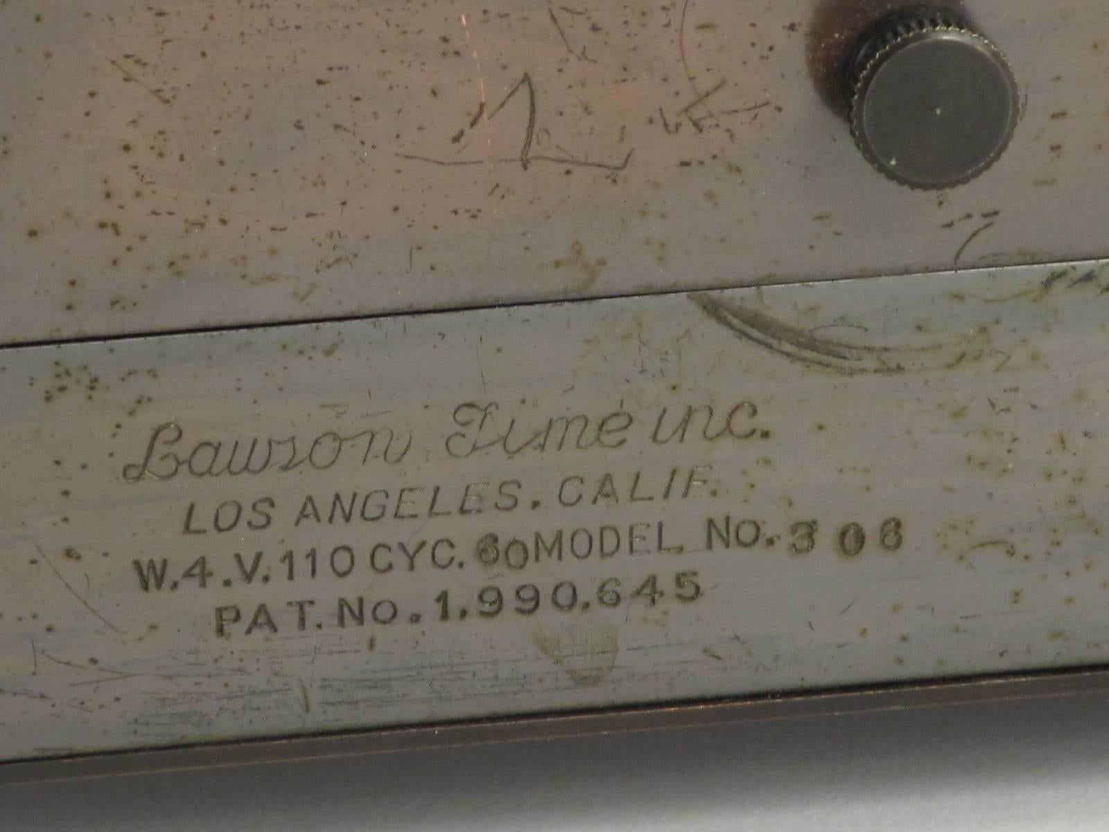 Although this Lawson clock has the name of W T Stokes engraved on it, it also has the inscription of Class of June '37. Nice graduation gift Stokes!. It runs well and quietly. Although the patina is somewhat distressed, it has a great Art Deco