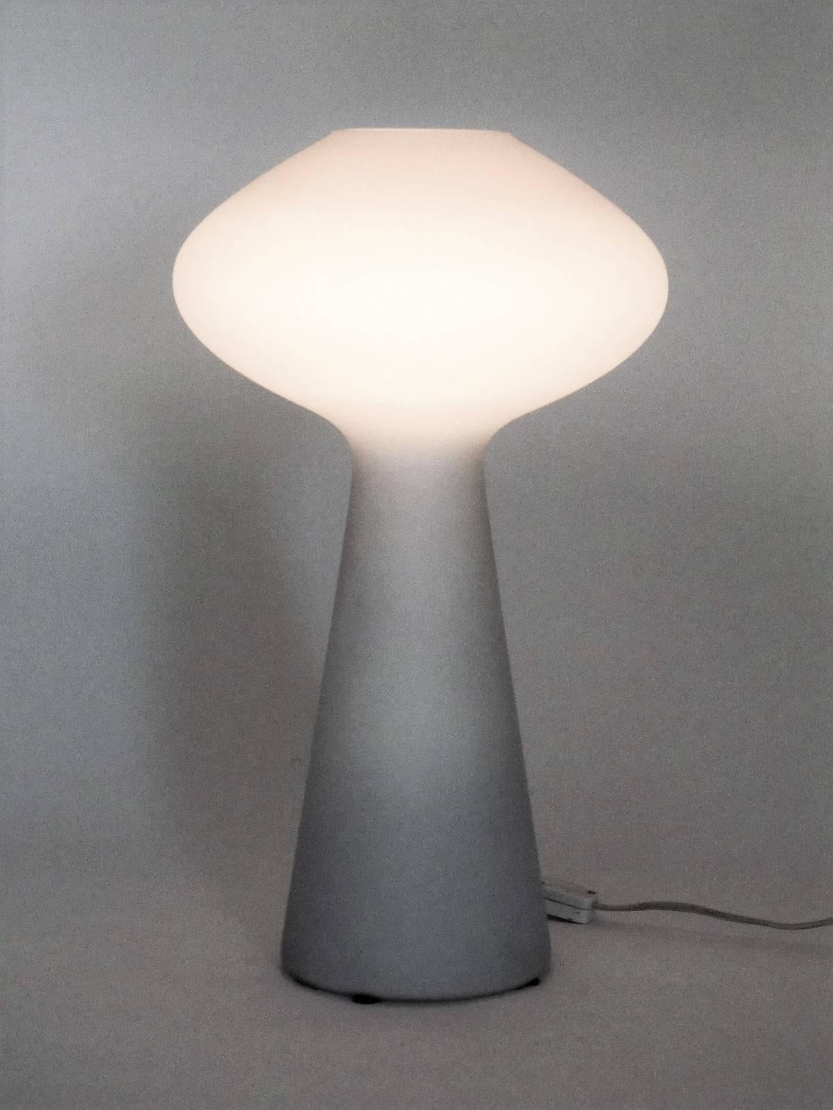 The thing about Finnish modern design is it's unwavering adherence to minimalism and strong simple lines. This lamp makes a prime example. Simple yet elegant curves, and its pure white color give these lamps an ethereal beauty.