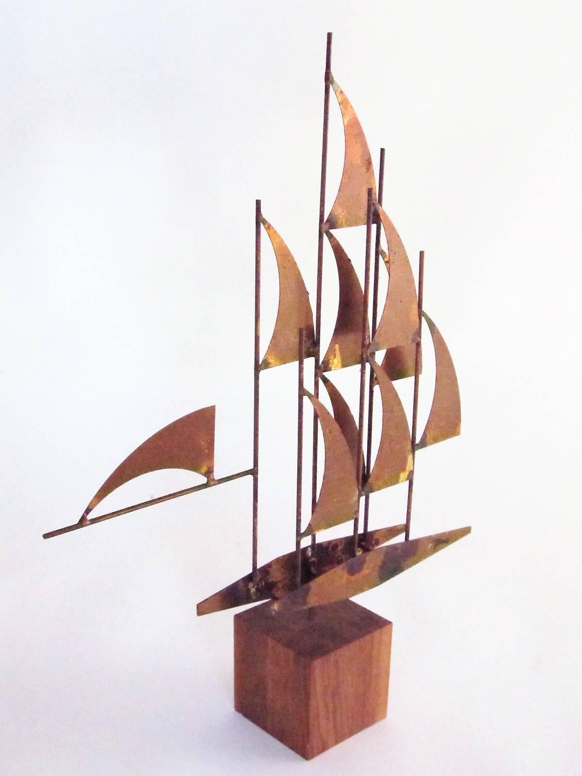 More common wall sculptures are to be found by this artist, William Bowie. But this variation is made as a table or desk sculpture. 

The base is a 3.25