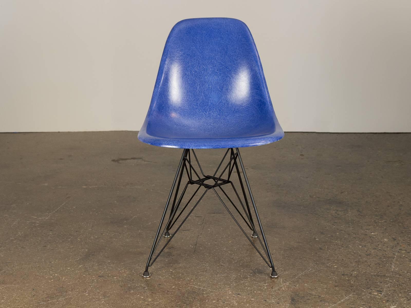 Original 1960s molded fiberglass shell chairs in Ultramarine Blue, designed by Charles and Ray Eames for Herman Miller. Gleaming shells are in original condition, each with a distinct thready texture.  Shown here mounted on new black Eiffel base,