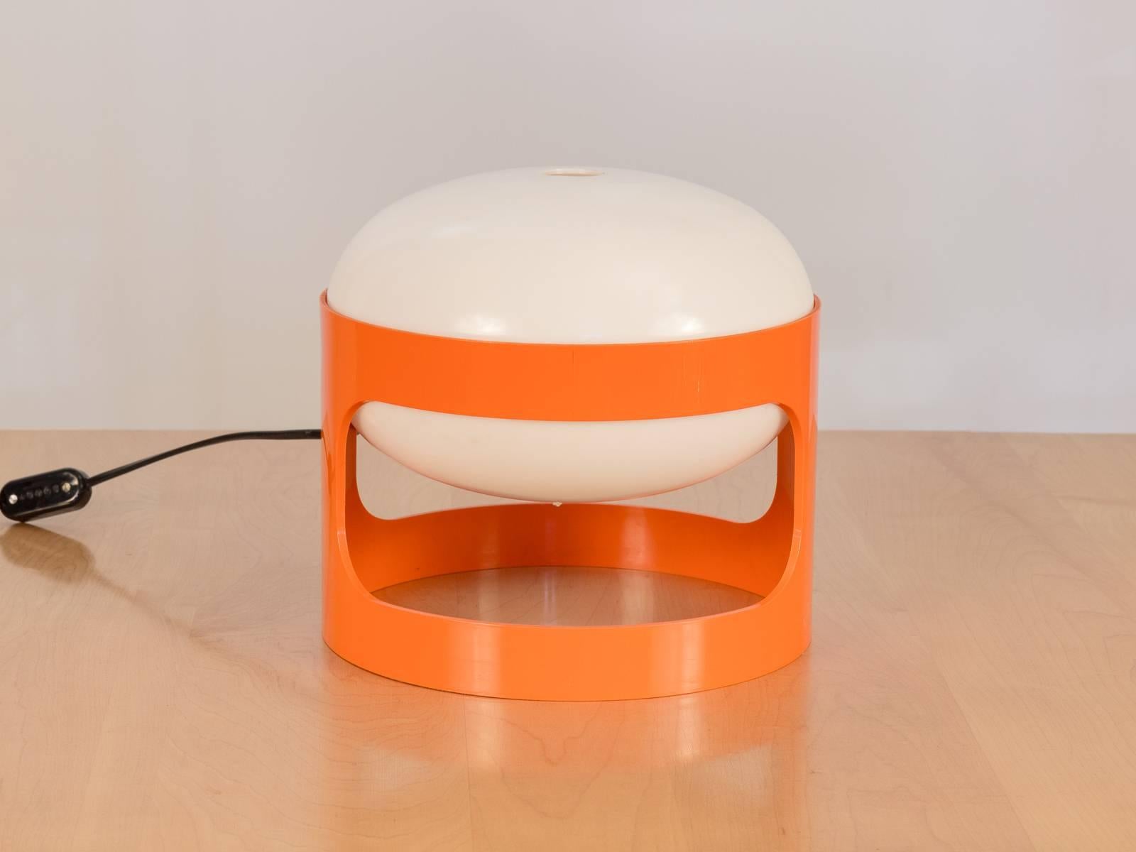 Space Age orange acrylic KD27 table lamp designed by Joe Colombo for Kartell in 1967. Base and lamp are in excellent vintage condition, glossy and vivid. Light works perfectly.

    