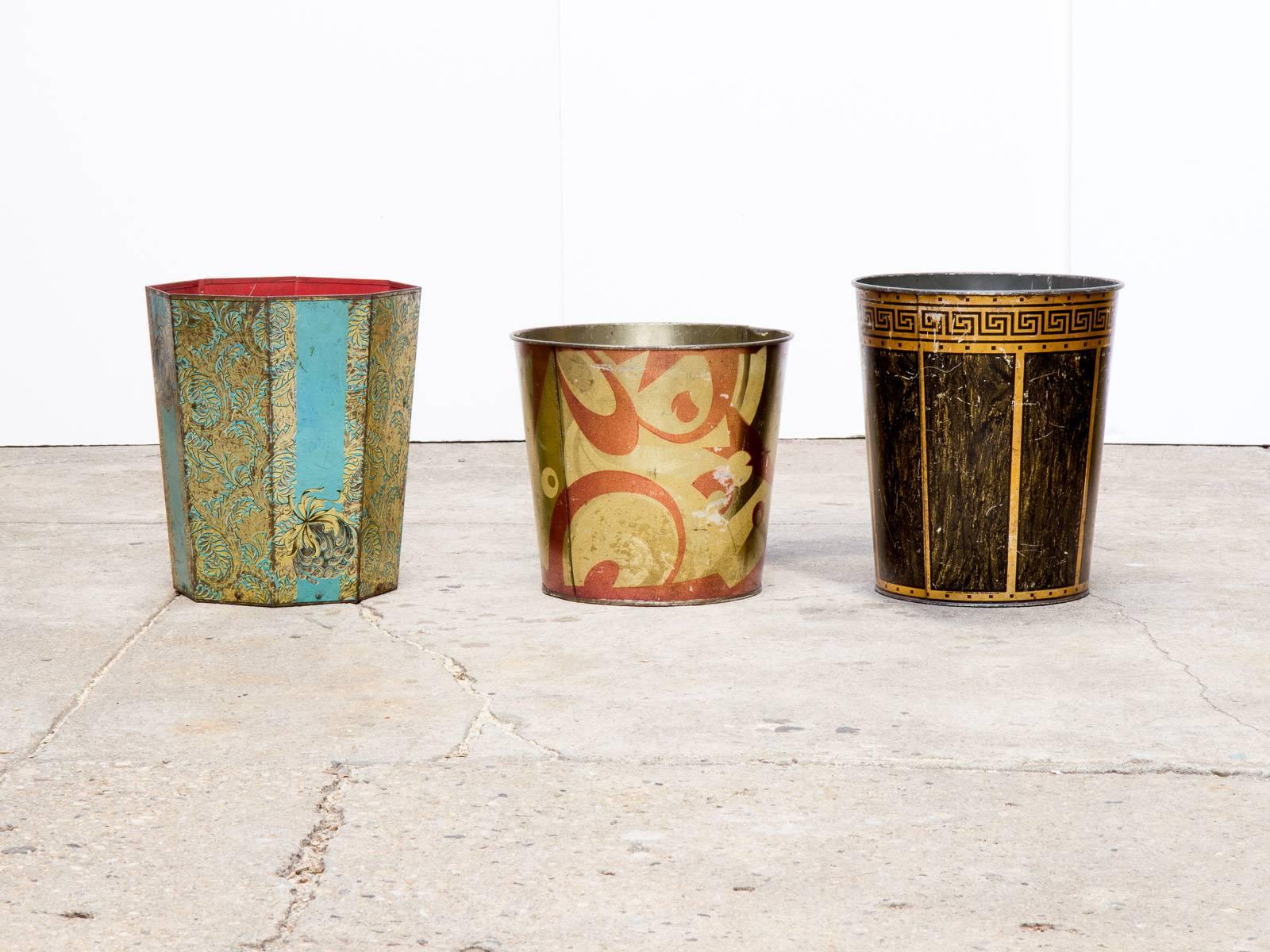 Eight eye-catching tin wastepaper baskets from the 1950s and 1960s. Evocative of the era, each one features a unique and vivid graphic motif and bright color scheme. Age-appropriate wear to the outside; interiors exhibit slight soiling.

 