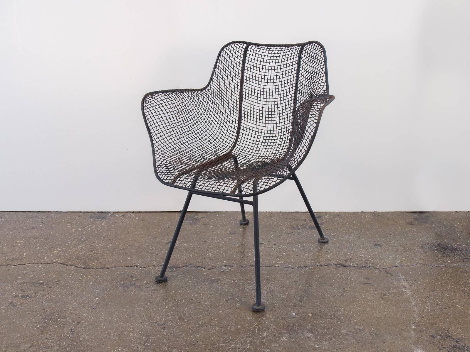 Two vintage black Sculptura chairs. The Sculptura furniture line was designed in the 1950s by Russell Woodard. This set dates to the 1960s and have their original finish. The chairs have some surface rust and need to be painted or powder-coated. All