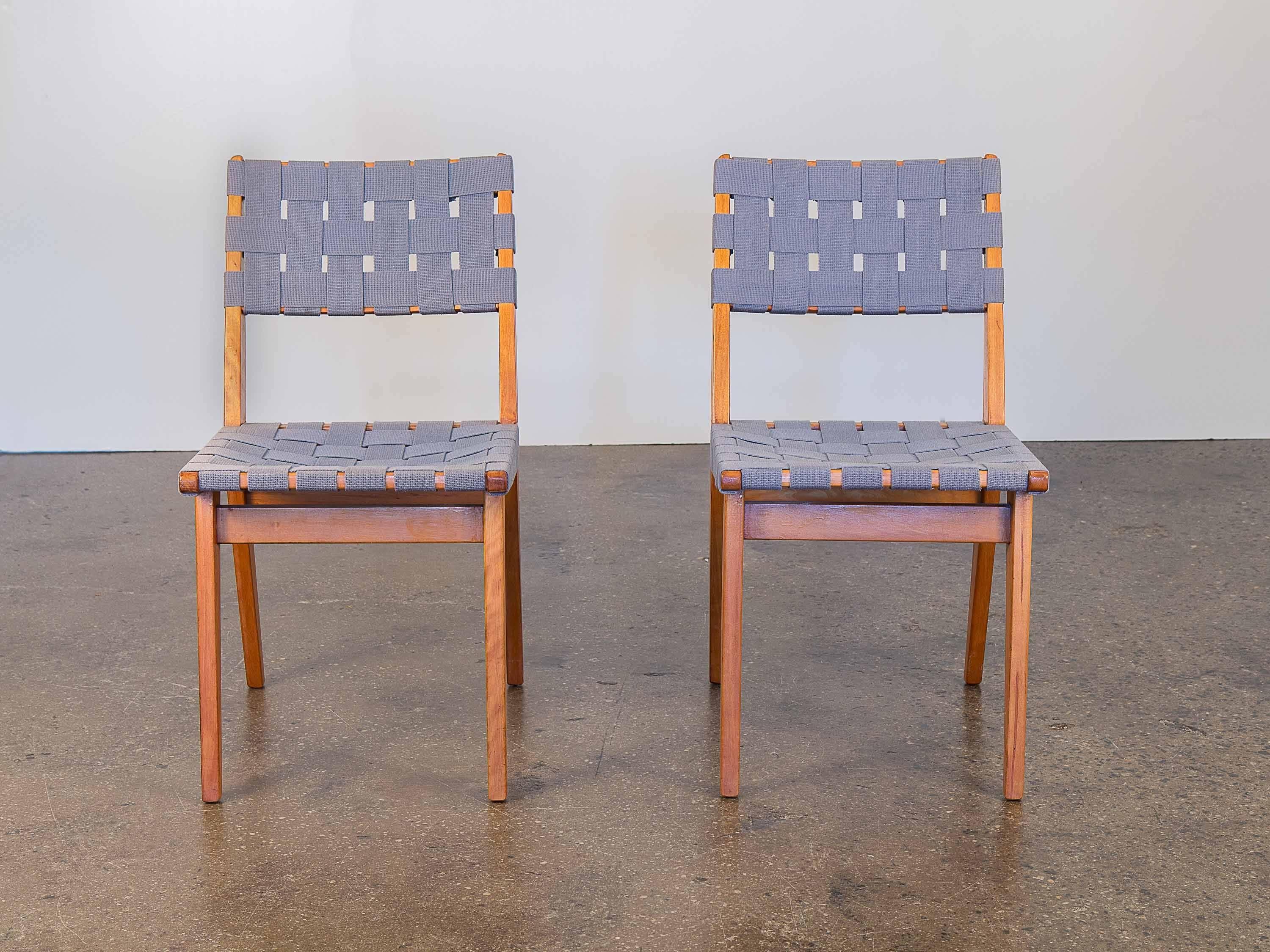 Jens Risom side chairs from 1941 for Knoll. Solid birch construction with rarely seen and blue woven webbing. An interesting example of early Scandinavian American design. As seen in the original 1950 Knoll associates catalogue. Chairs sold as a