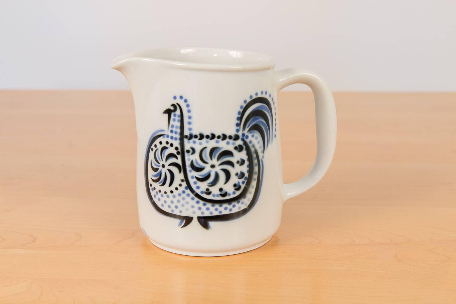 Mid-sized ceramic pitcher by Arabia with charming hen illustration and petite creamer with butterfly illustration, 1960s, marked on the underside and made in Finland. Pitcher is $250 and creamer is $150. Contact for group pricing.
Pitcher measures: