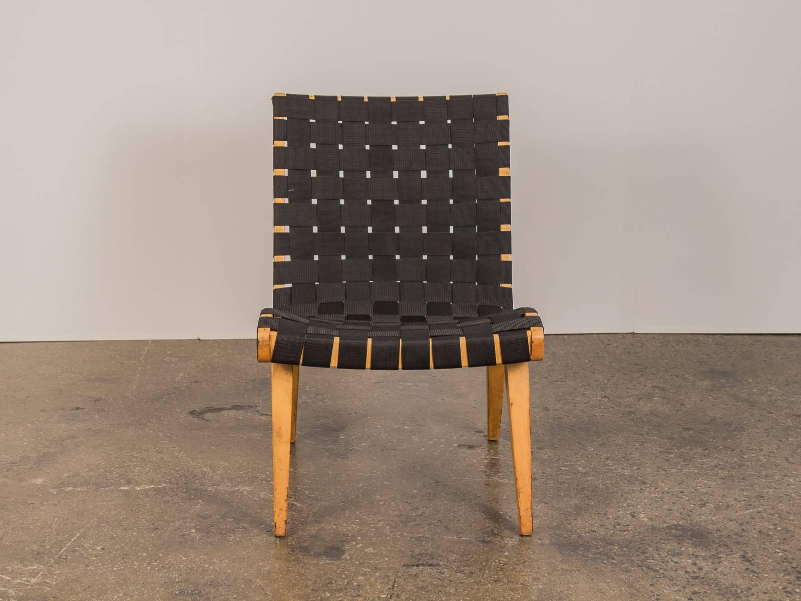 Scrupulous, undisputed Risom lounge chair by Jens Risom for Knoll. This chair retains the original maple wood frame which dates to the late 1940s with newly woven chair straps. Great vintage condition. Understated, early design example that