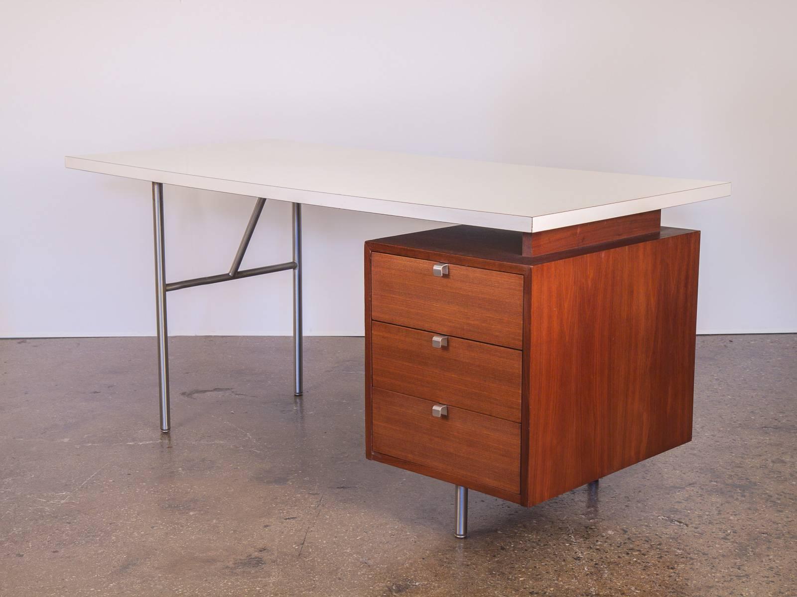 1960s Modular George Nelson Formica walnut desk with typewriter desk for Herman Miller. This system is in excellent vintage condition—all the wood has been polished and refreshed, the white Formica surface is clean and smooth. Adorned with the