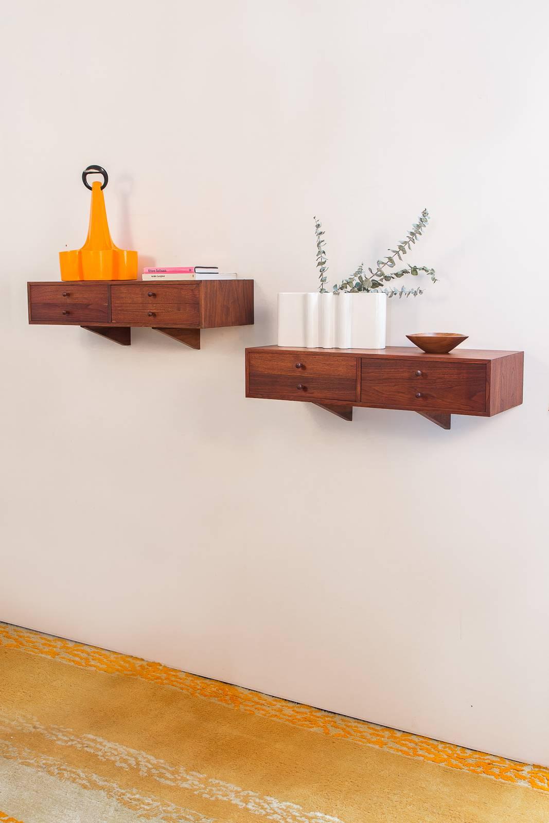Priced individually, only one left. Scandinavian modern, walnut floating shelf that doubles as a charming storage unit. The shelves date from the 1960s, and are in excellent, restored condition with a gleaming wood selection. The illusory