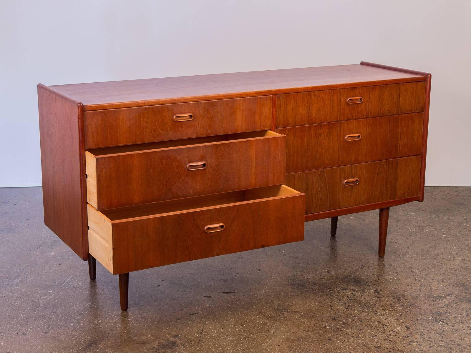 1960s, Danish modern teak double dresser. In excellent vintage condition. Handsome teak with a distinct wood grain. Top is free of indentations or rings, very clean. Top two drawers measure 4.5