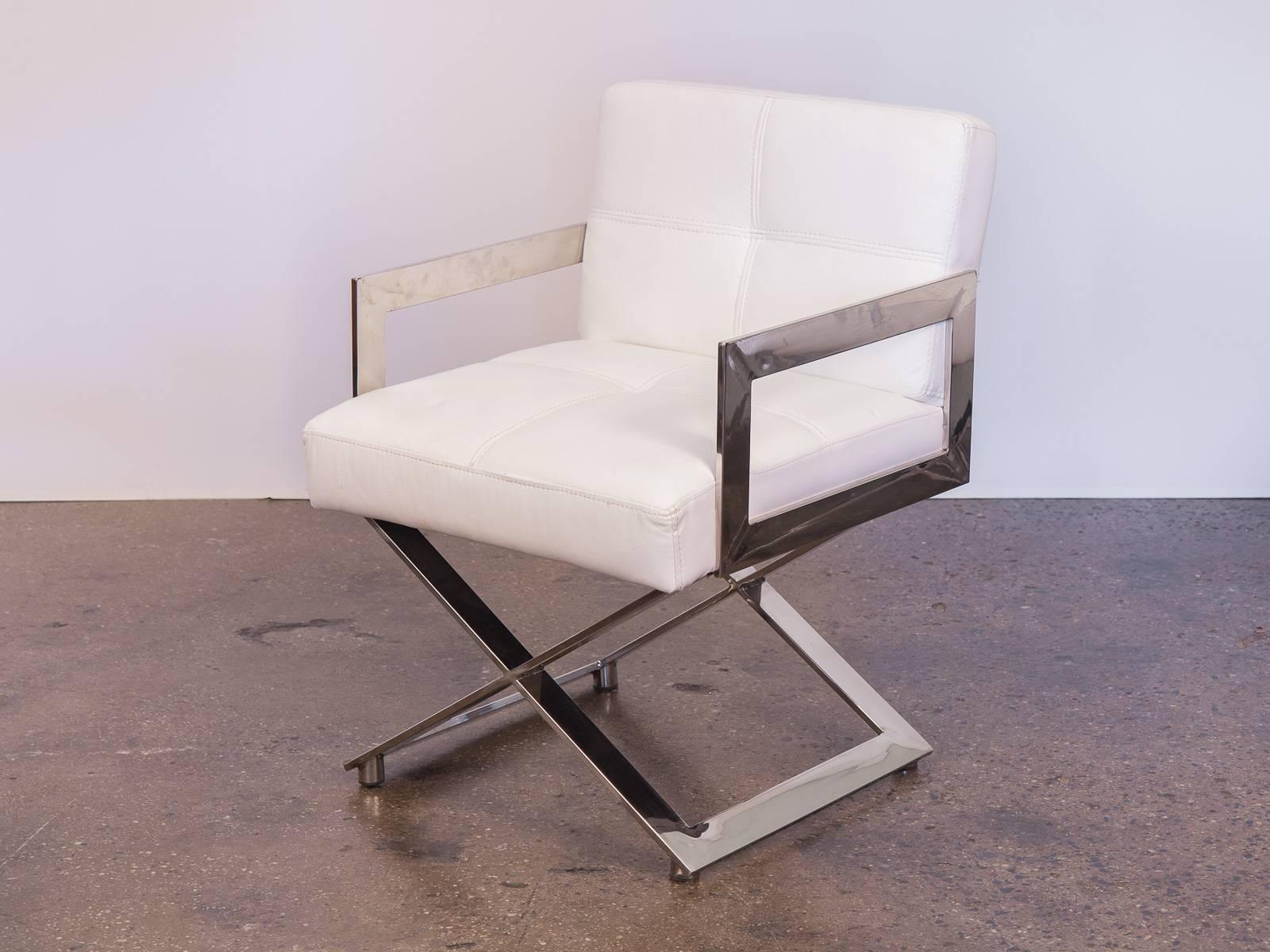 Set of ten Milo Baughman style chrome dining chairs. In excellent vintage condition, the white leather is very clean, with no rips or stains consistent throughout all the chairs. Impressive around a dining table or in an office.

Individual chairs
