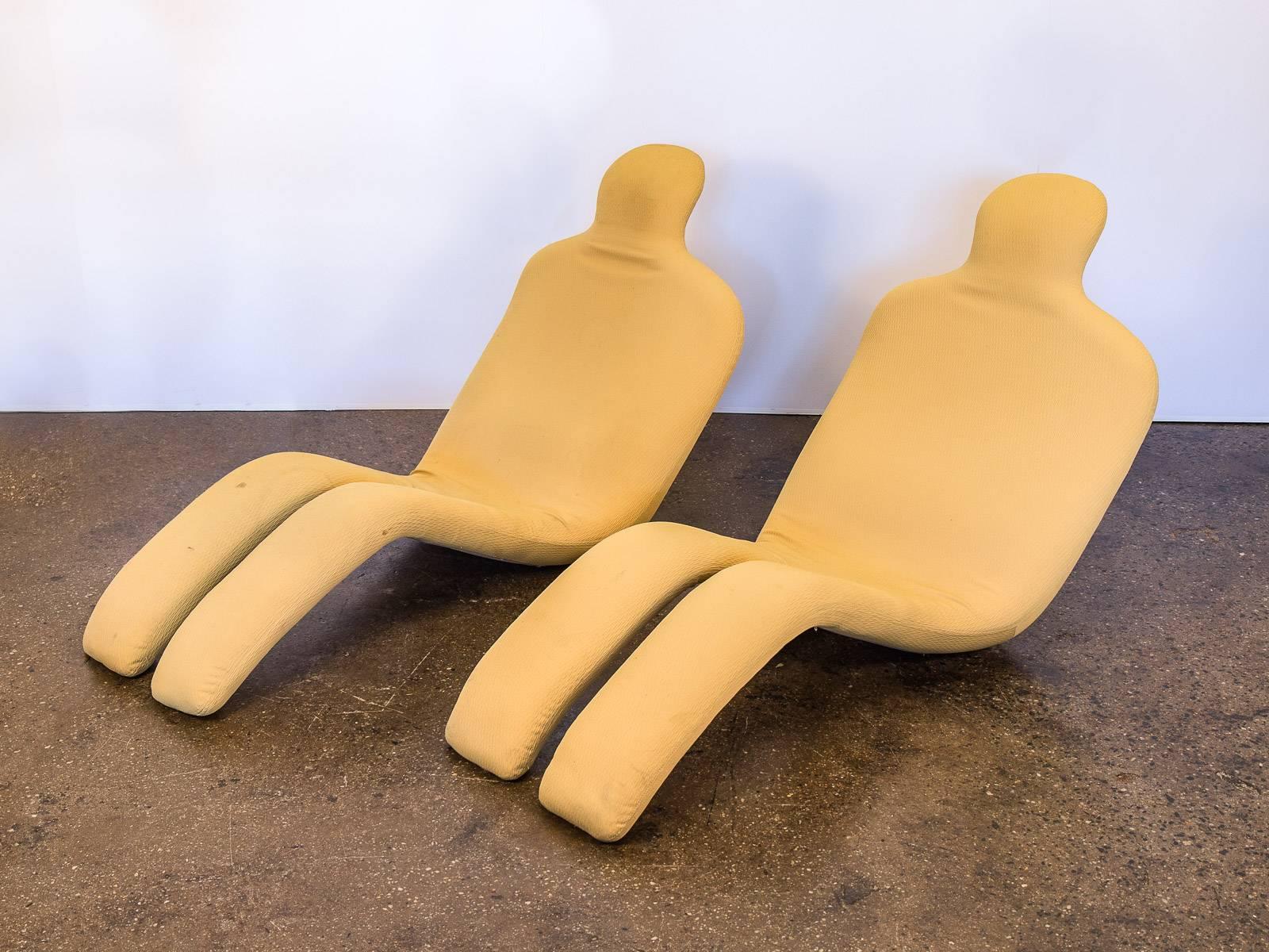 Pair of original Bouloum chairs designed by Olivier Mourgue. Innovative and bold, undulating anthropomorphic lounge chairs. A supremely comfortable chair that helped shape design modernity. In great condition, with some stains to the fabric on one