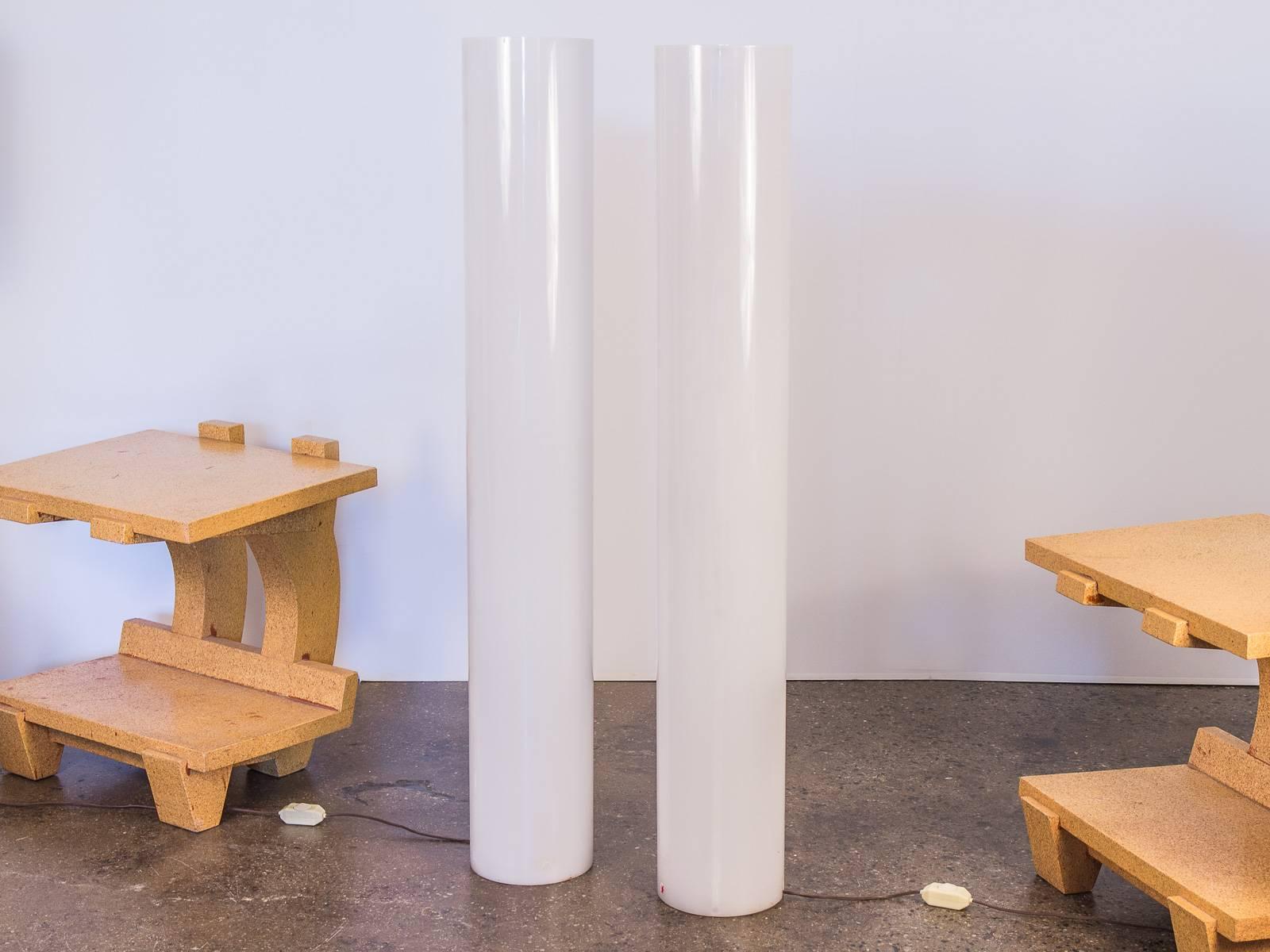 Sold as a pair. Column floor lamps by Paul Mayen for Habitat. These architecturally sculptural, clean cylinder floor lamps are stylishly graphic lighting option to adorn a room. White acrylic shades cover a light fixture that holds six bulbs and has