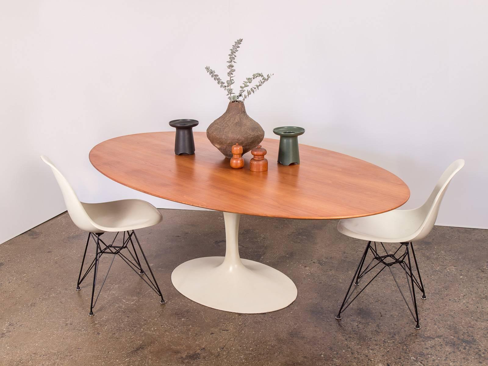 Timeless vintage Eero Saarinen oval dining table in walnut for Knoll Associates Inc. This is a vintage, all original 1950s example. Excellent condition. Impressive, substantial walnut surface has been cleaned, oiled, and polished and is gleaming and