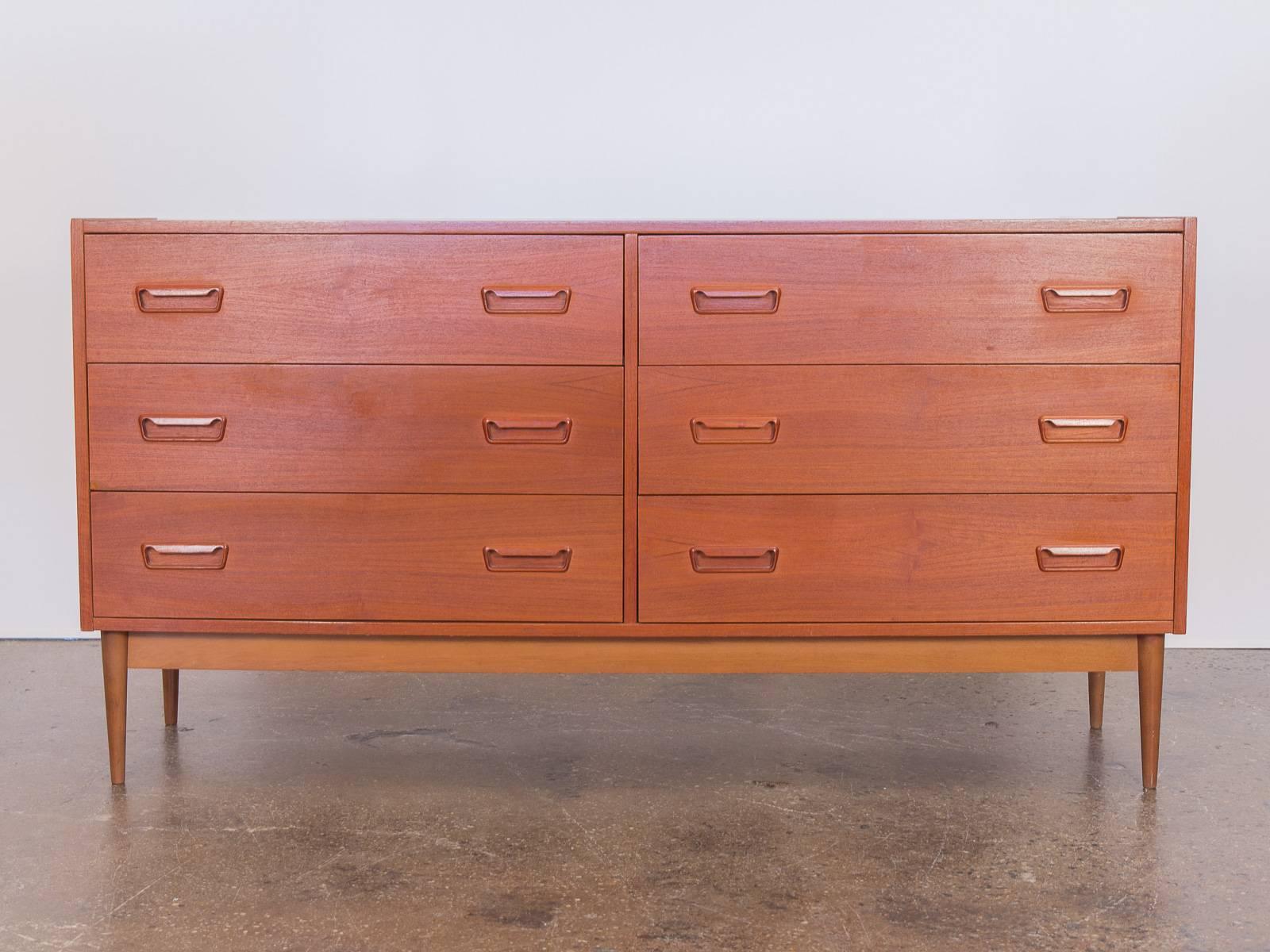 1960s, Danish modern teak double dresser. In excellent vintage condition. Handsome teak with a beautiful wood grain. Top is free of indentations or rings, very clean. Drawers are constructed with dovetail joinery and are complimented by the finely