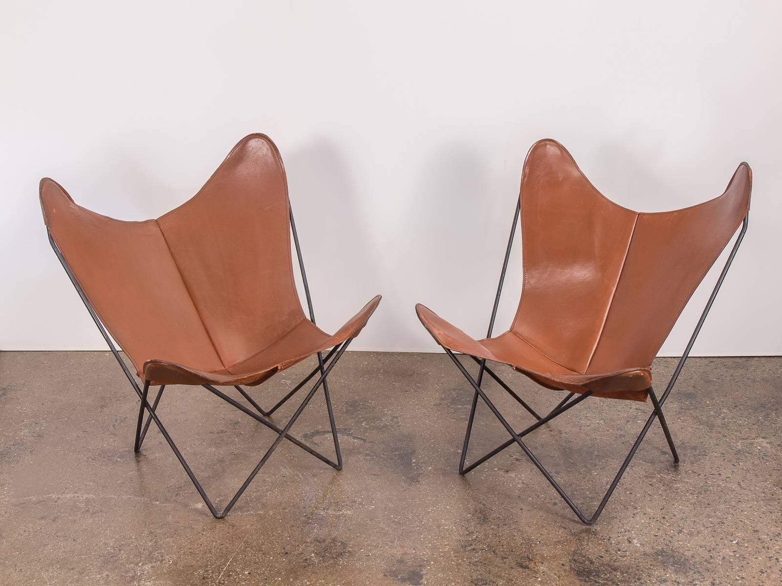 Pair of vintage Hardoy Butterfly BKF chairs for Knoll. These examples are from the 1960s, and are very high quality, hand stitching is tight and the thick, tobacco brown leather has a gentle patina which will ripen handsomely with time. Varying