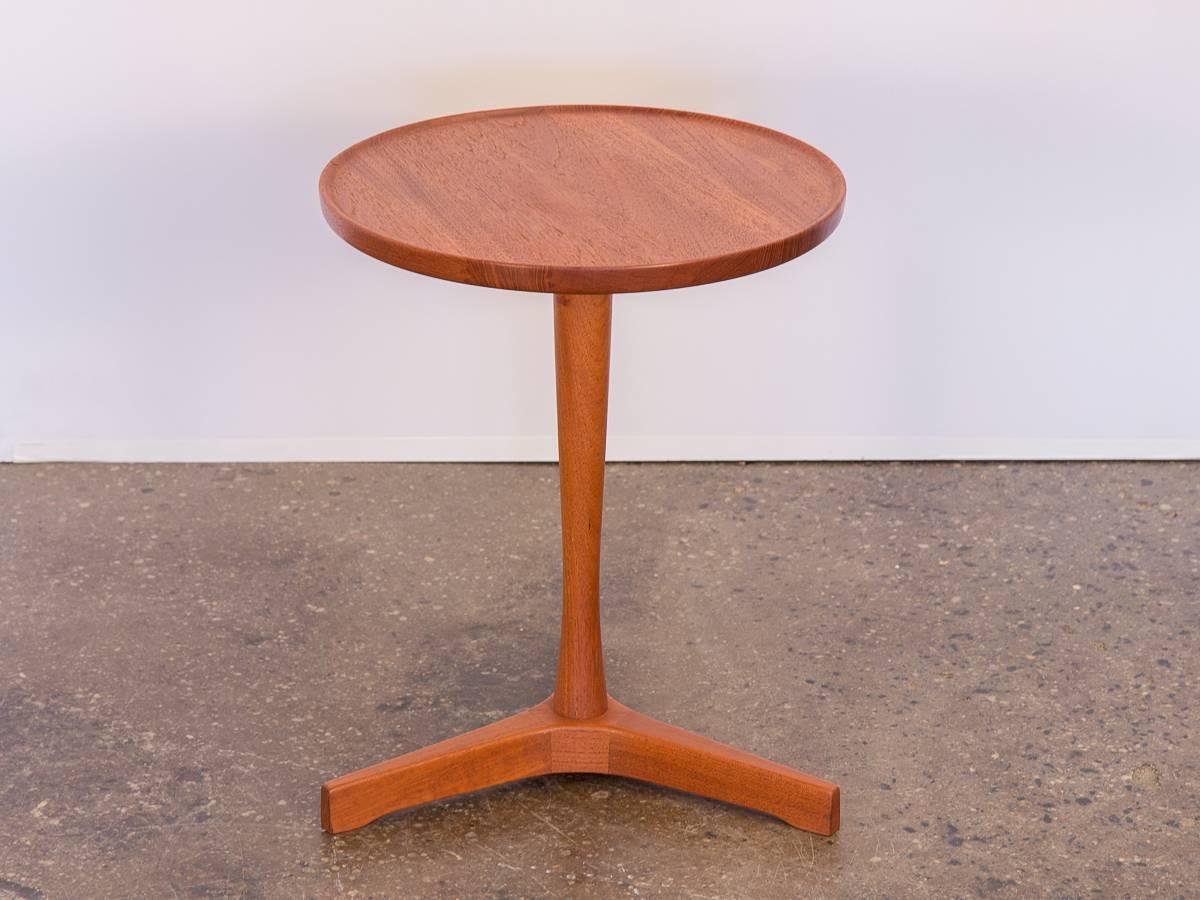 Scandinavian Modern Hans Andersen teak end table for Artex. Gleaming teak wood has been hand-oiled, hand-polished, with a beautiful luster. Round table surface is in excellent condition with no visible scratches or dents, overall very little sign of