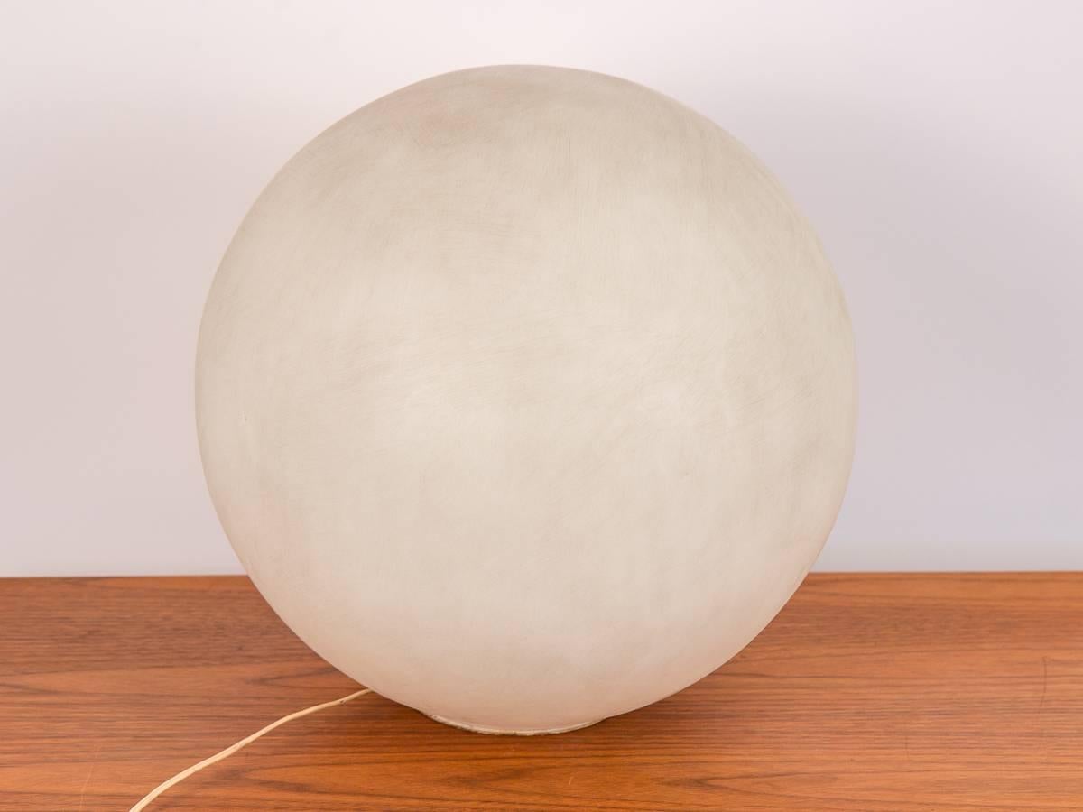 The original Globe Lamp by Paul Mayen for Habitat. This recognizable, mod light fixture features a barely visible base, allowing it to appear floating. Our example is in good vintage condition; spherical acrylic shade has a good age to it, and light