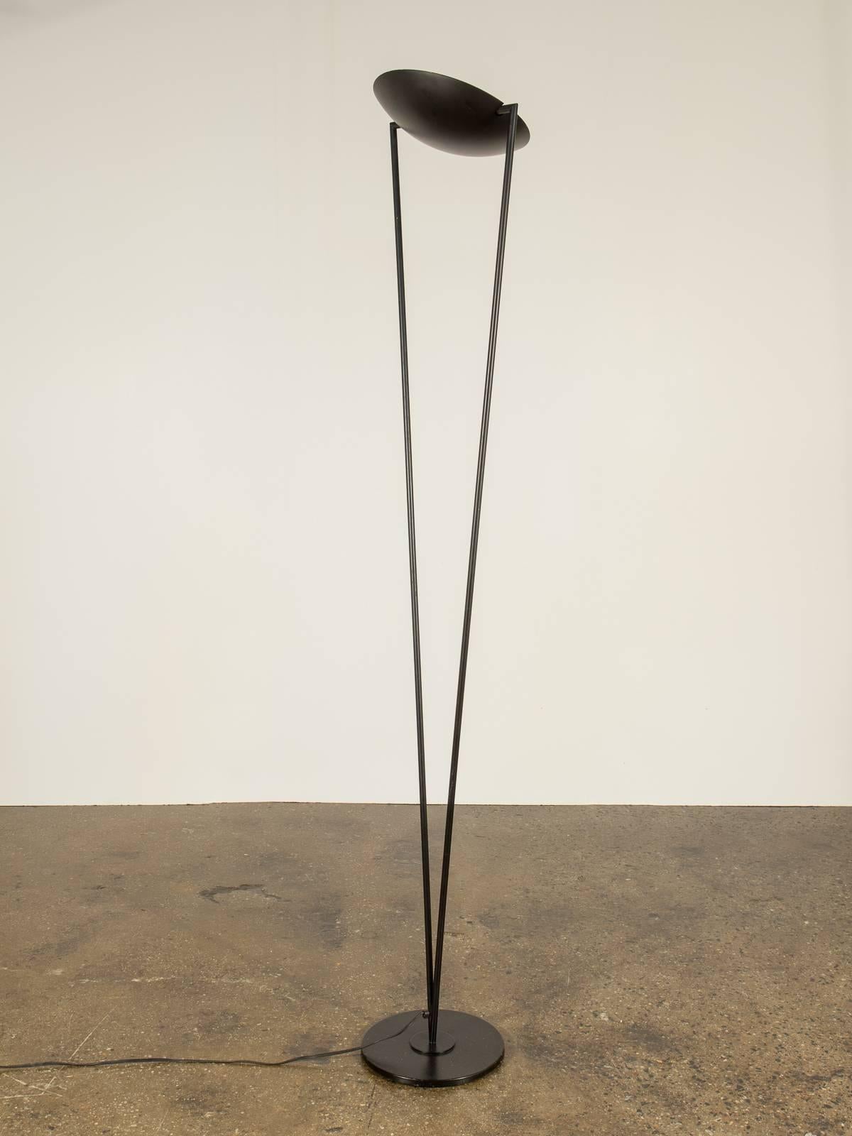 Striking black modernist floor lamp. Circular shade is fully adjustable. Dimmer switch marked Relco, Italy. In perfect working condition. 1970s.

The shade is 11.25
