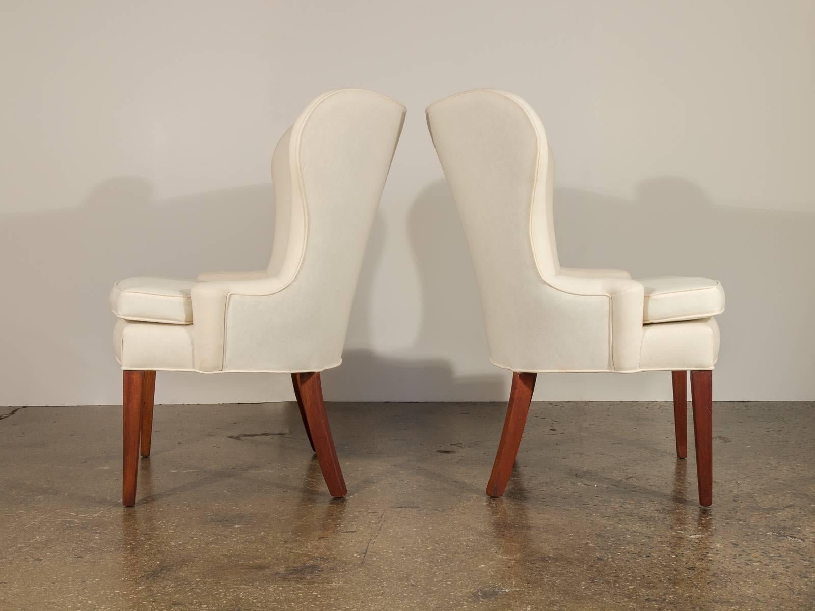 A generous shape and clean-cut modernist lines create a fantastic form for the mid-century connoisseur. The chairs are upholstered in muslin so that their pure lines may be readily appreciated; we recommend covering them in a fabric of your