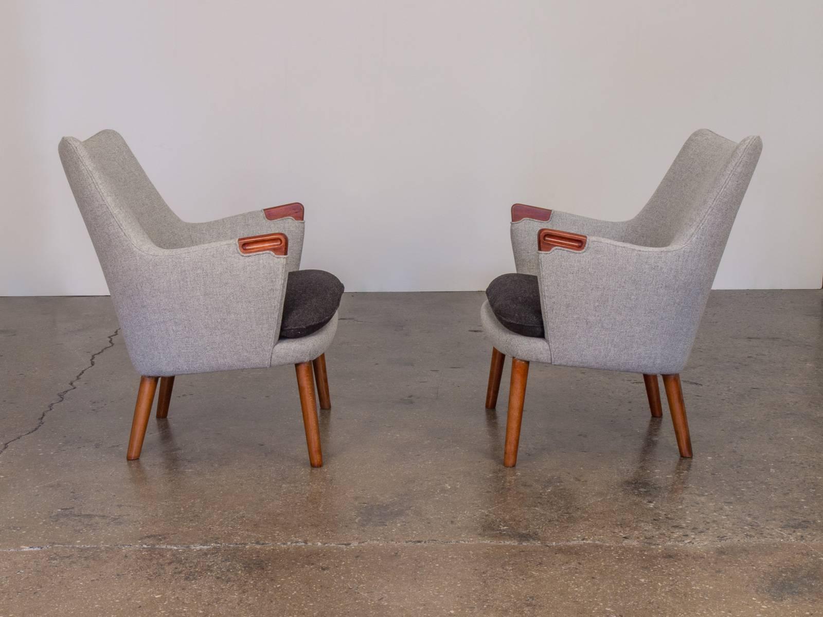 A scarce pair of Hans Wegner AP-20 chairs. Manufactured by AP Stolen, Denmark, circa 1954. Our chairs have been faithfully restored and upholstered in Maharam Tonica by Kvadrat. Chairs are stunning in every way! A sample swatch of material is