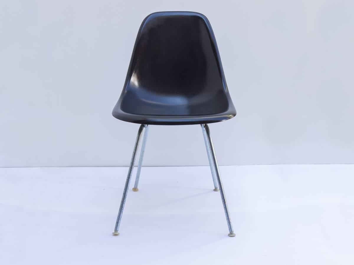 We have 20 vintage shell chairs in black. The chairs date to the 1990s and were made by Herman Miller. They are shown on vintage H bases and we have other base options available. They look especially sharp on black Eiffel bases, as shown in the last