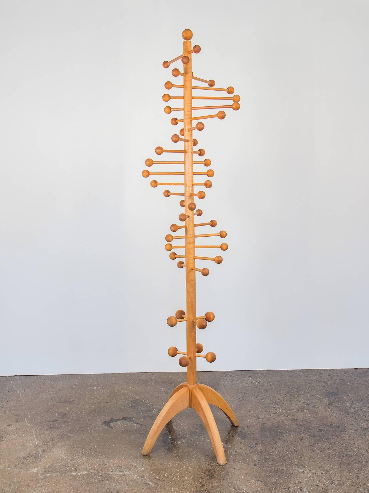 This double helix coat tree designed after the familiar DNA molecule is a playful homage to the Eames Atomic era. Whether embellishing your hall or adorned with clothing it is a wonderful sculptural touch. Crafted in maple, in excellent vintage