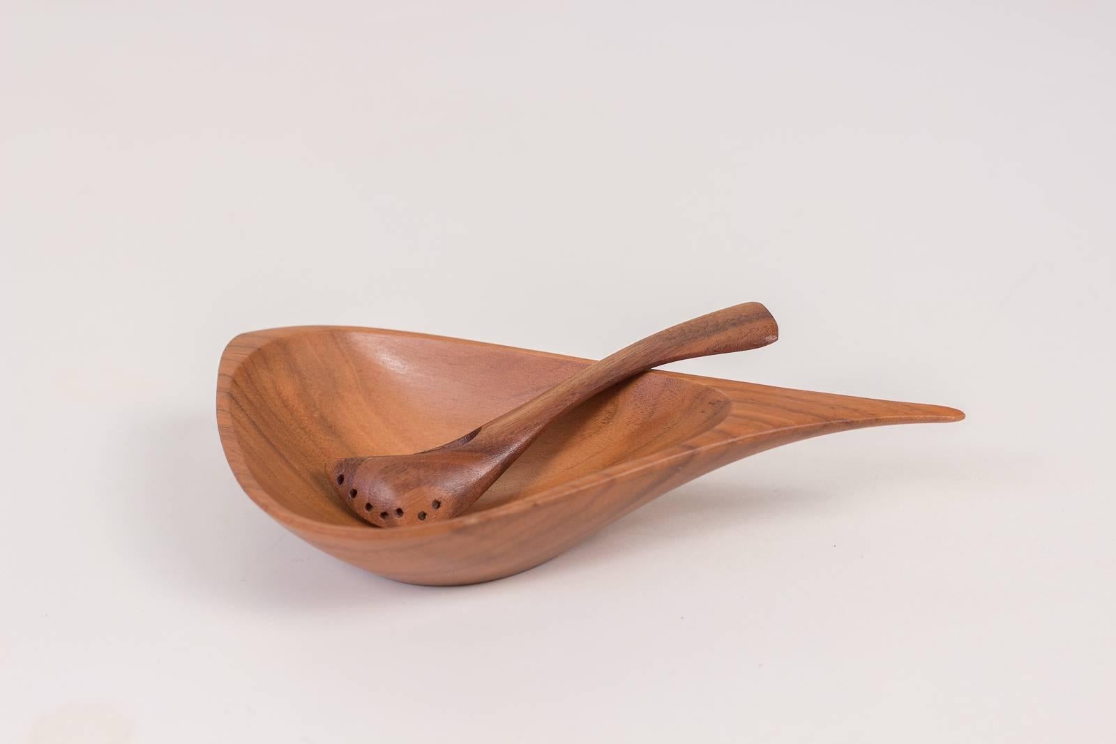 Diminutive, sculpted salt bowl and spoon carved from walnut by under-appreciated American teacher and woodworker, Emil Milan. Like his contemporaries Wharton Esherick and George Nakashima, Milan’s primary practice revolved around his finely crafted