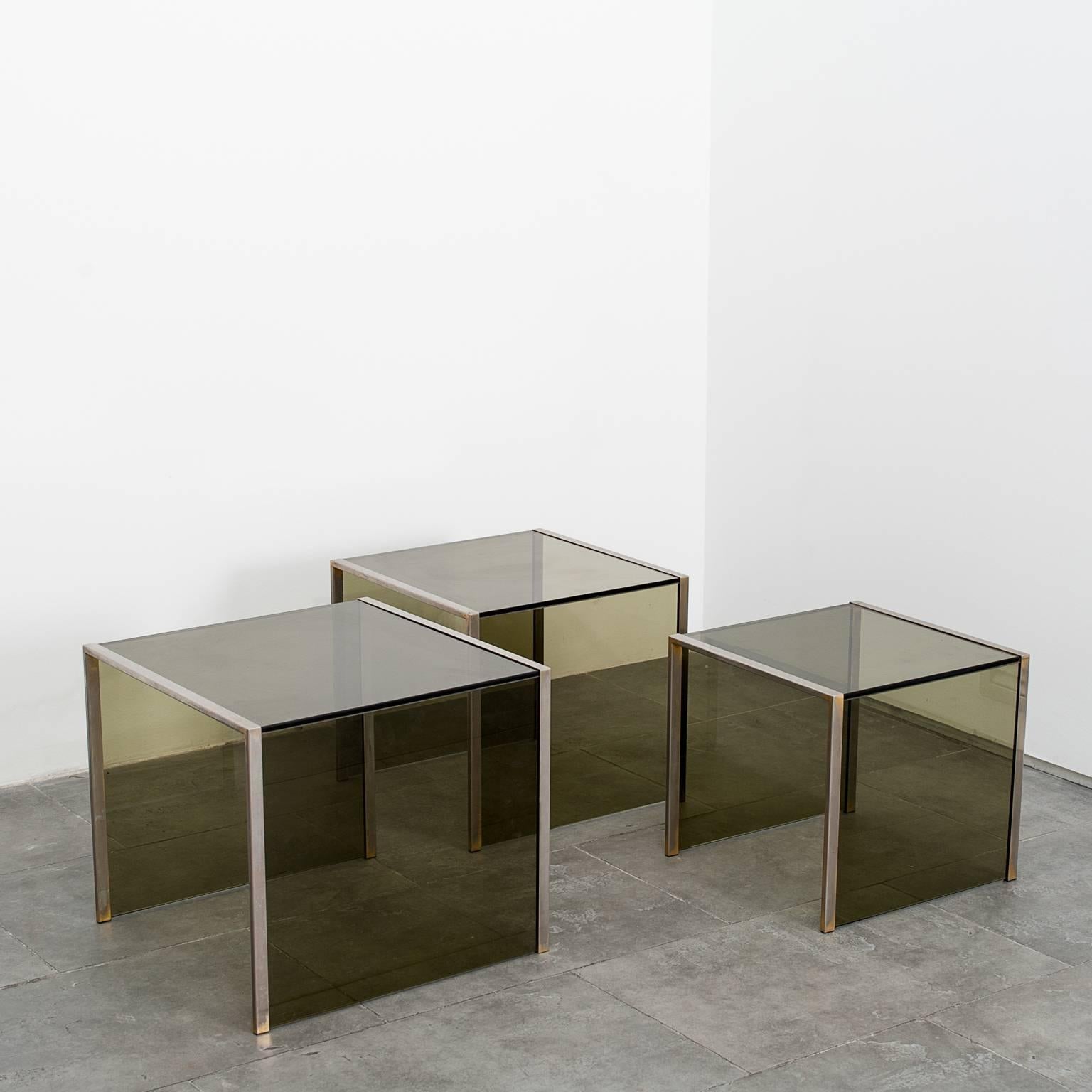 Set of three smoked glass nest side tables.