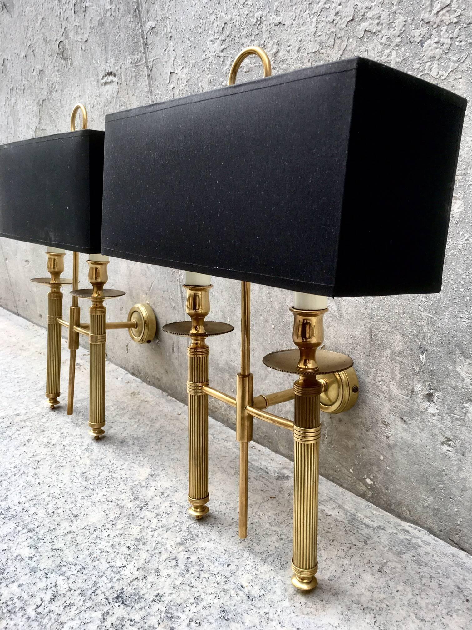 Pair of elegant brass sconces Bagues style, original condition from 1950. New shades in black with gold interior, France.