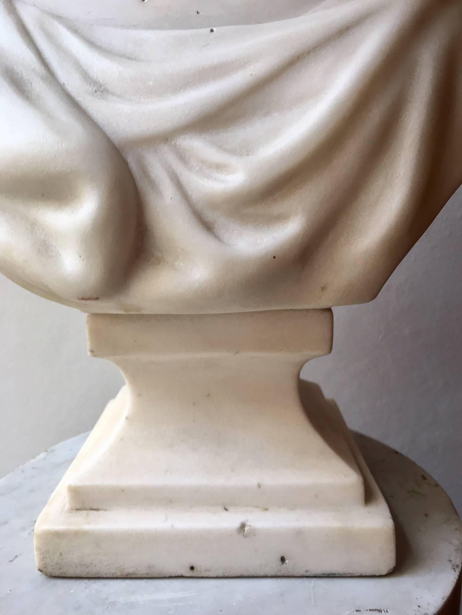 19th century beauty Italian marble bust of young girl, resting on a pedestal marble, the bust is signed behind.