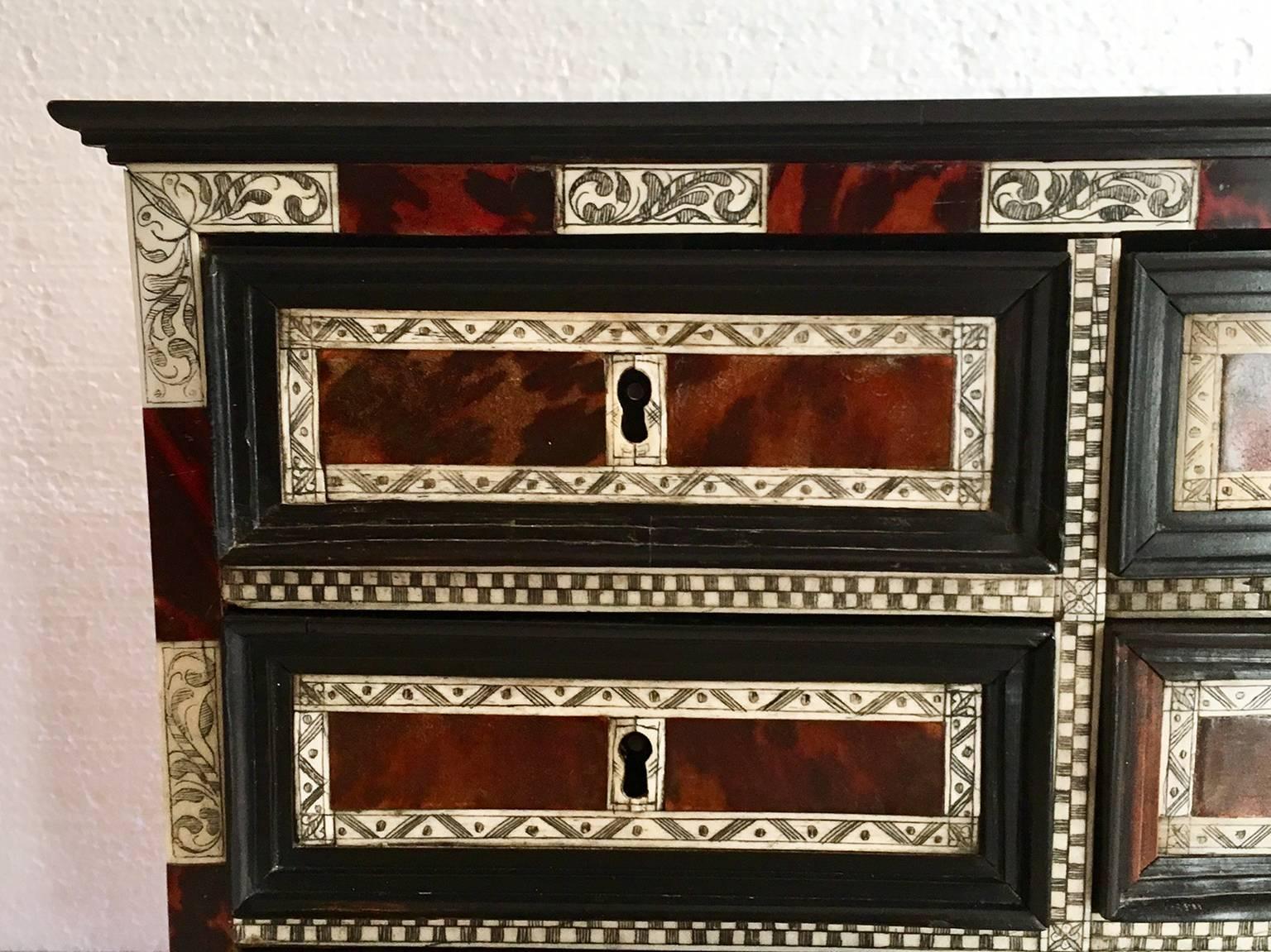 17th century Spanish colonial cabinet, reneered with ebony, ivory and tortoiseshell, five drawers.