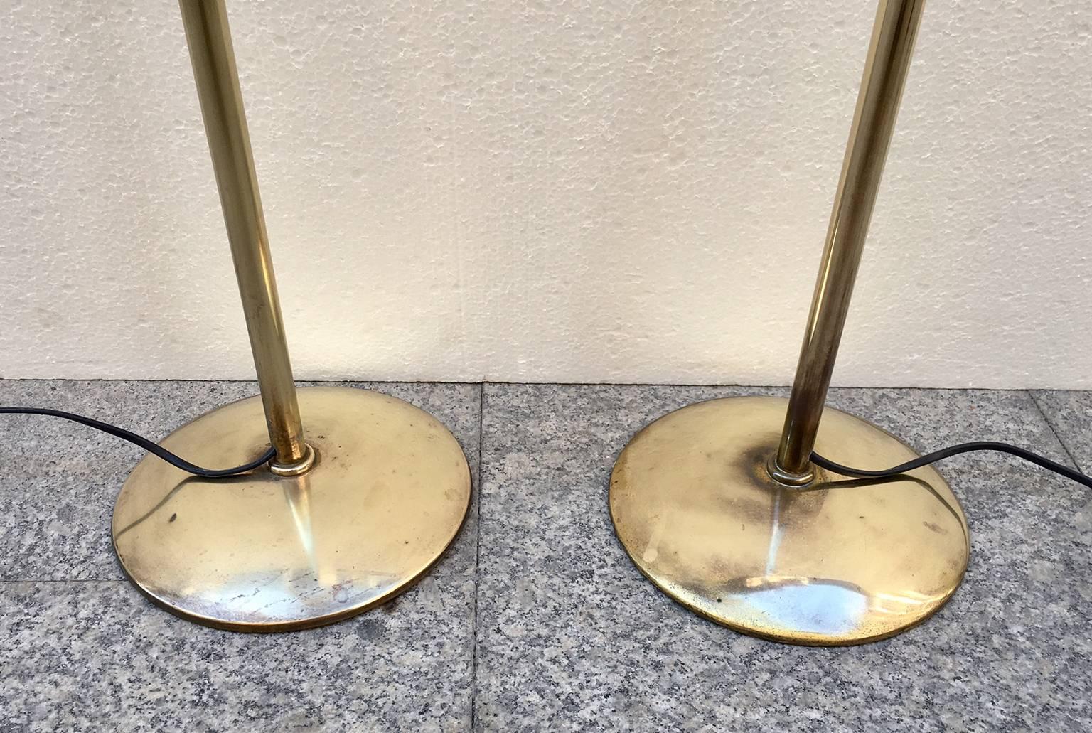 Pair of midcentury brass floor lamps, the lamps have been polished and rewired, height adjustable.