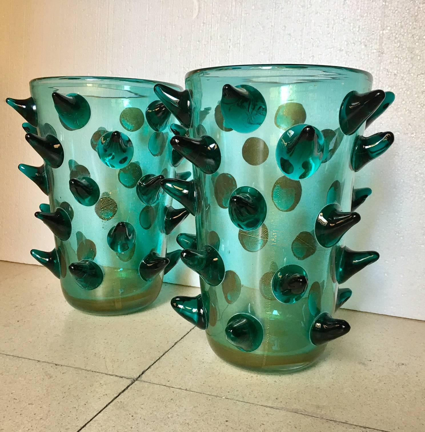 Pair of vases signed by Constantini, made in green Murano glass, gold sprinkled technique, peaks decorate the outside.